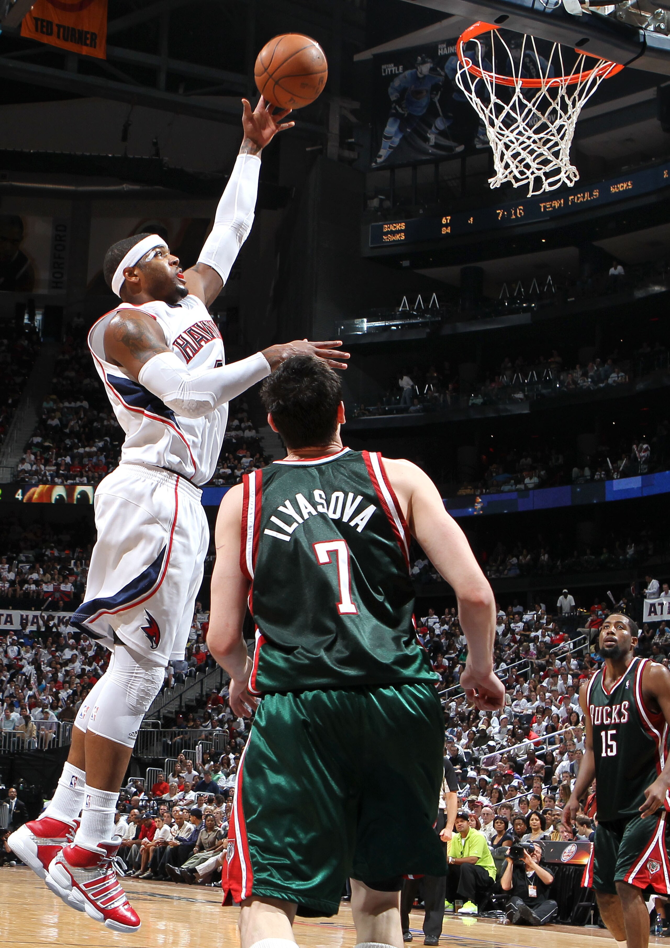 ATLANTA - MAY 2:  Forward Josh Smith #5 of the Atlanta Hawks shoots over forward Ersan Ilyasova #7 of the Milwaukee Bucks while guard John Salmons #14 (R) looks on during Game Seven of the Eastern Conference Quarterfinals during the 2010 NBA Playoffs at P