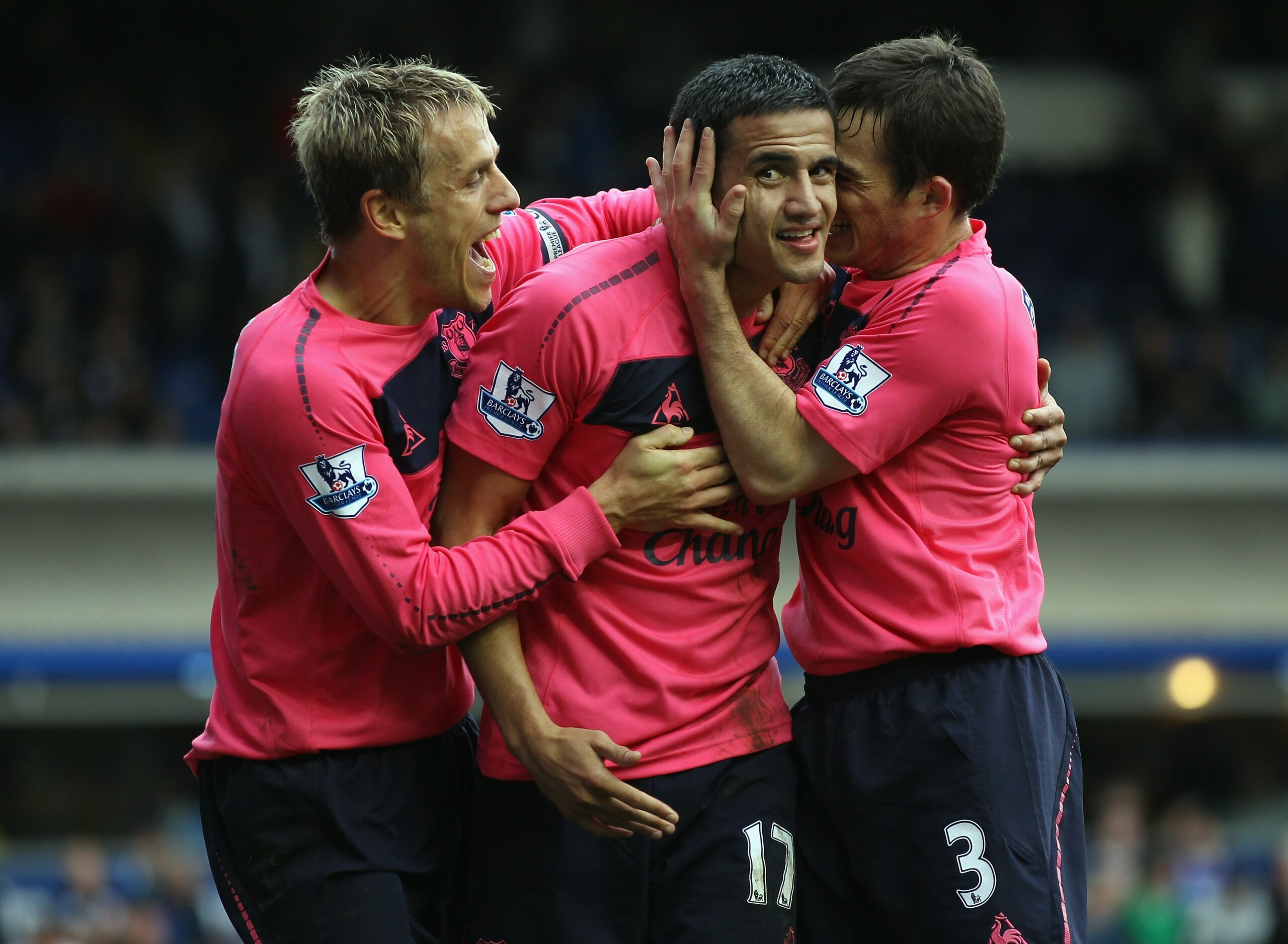 BIRMINGHAM, ENGLAND - OCTOBER 02:  Tim Cahill of Everton celebrates scoring with team mates Phil Neville and Leighton Baines during the Barclays Premier League match between Birmingham City and Everton at St Andrews on October 2, 2010 in Birmingham, Engla