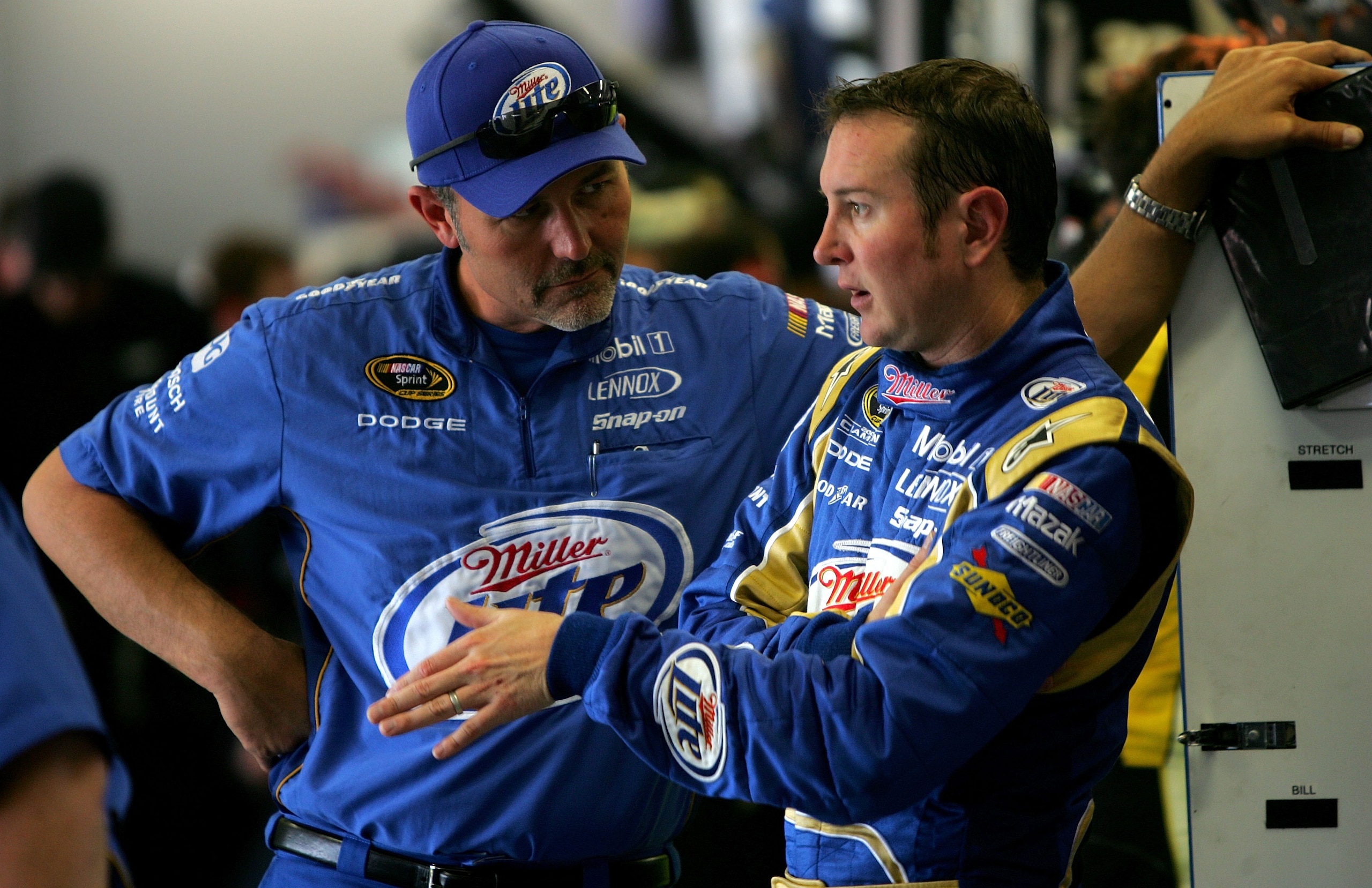 FORT WORTH, TX - APRIL 16:  Kurt Busch (R), driver of the #2 Miller Lite Dodge, talks with crew chief Steve Addington in the garage during practice for the NASCAR Sprint Cup Series Samsung Mobile 500 at Texas Motor Speedway on April 16, 2010 in Fort Worth