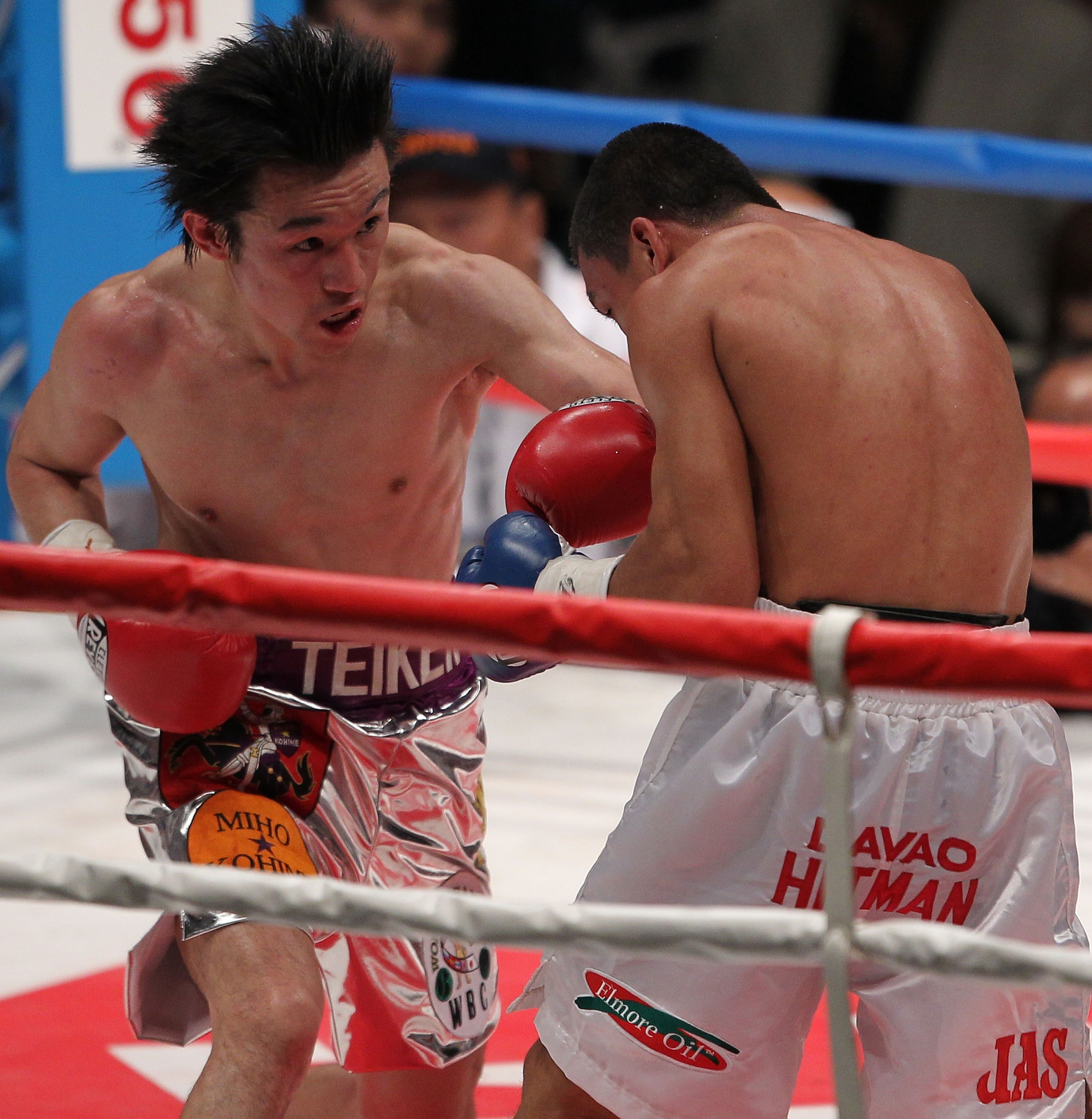 TOKYO - APRIL 30:  Champion Toshiaki Nishioka of Japan (L) exchange punches with challenger Balweg Bangoyan of the Philippines in action during the WBC Super-Bantamweight title fight at Nippon Budokan on April 30, 2010 in Tokyo, Japan.  (Photo by Koichi K