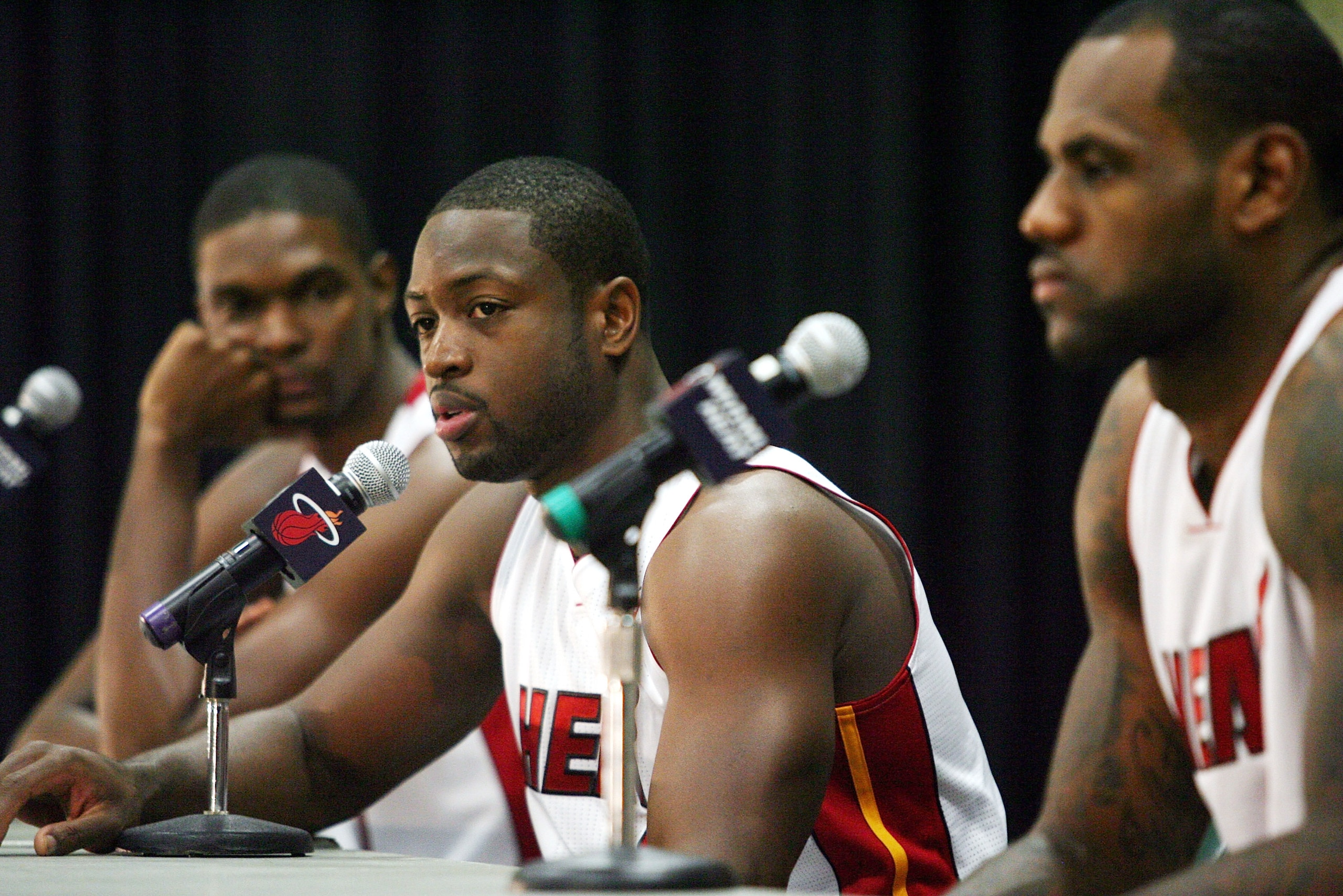 MIAMI - SEPTEMBER 27: (L-R) Chris Bosh, Dwyane Wade and LeBron James of the Miami Heat answers questions during media day at the Bank United Center on September 27, 2010 in Miami, Florida. NOTE TO USER: User expressly acknowledges and agrees that, by dow MIAMI - SEPTEMBER 27: (L-R) Chris Bosh, Dwyane Wade and LeBron James of the Miami Heat answers questions during media day at the Bank United Center on September 27, 2010 in Miami, Florida. NOTE TO USER: User expressly acknowledges and agrees that, by dow