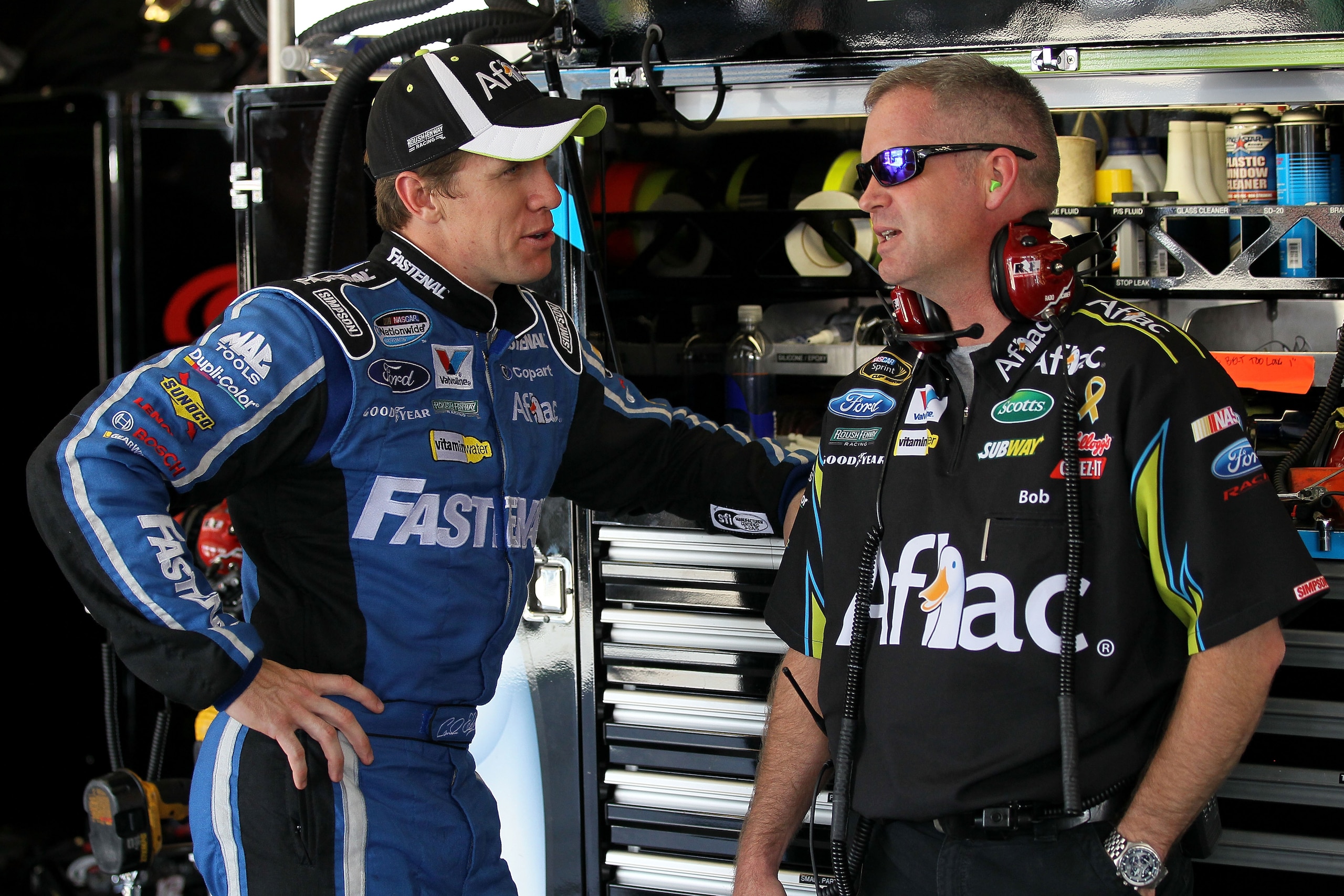 JOLIET, IL - JULY 09:  Carl Edwards (L), driver of the #99 Aflac Silver Ford, talks with crew chief Bob Osborne during practice for the NASCAR Sprint Cup Series LIFELOCK.COM 400 at the Chicagoland Speedway on July 9, 2010 in Joliet, Illinois.  (Photo by A