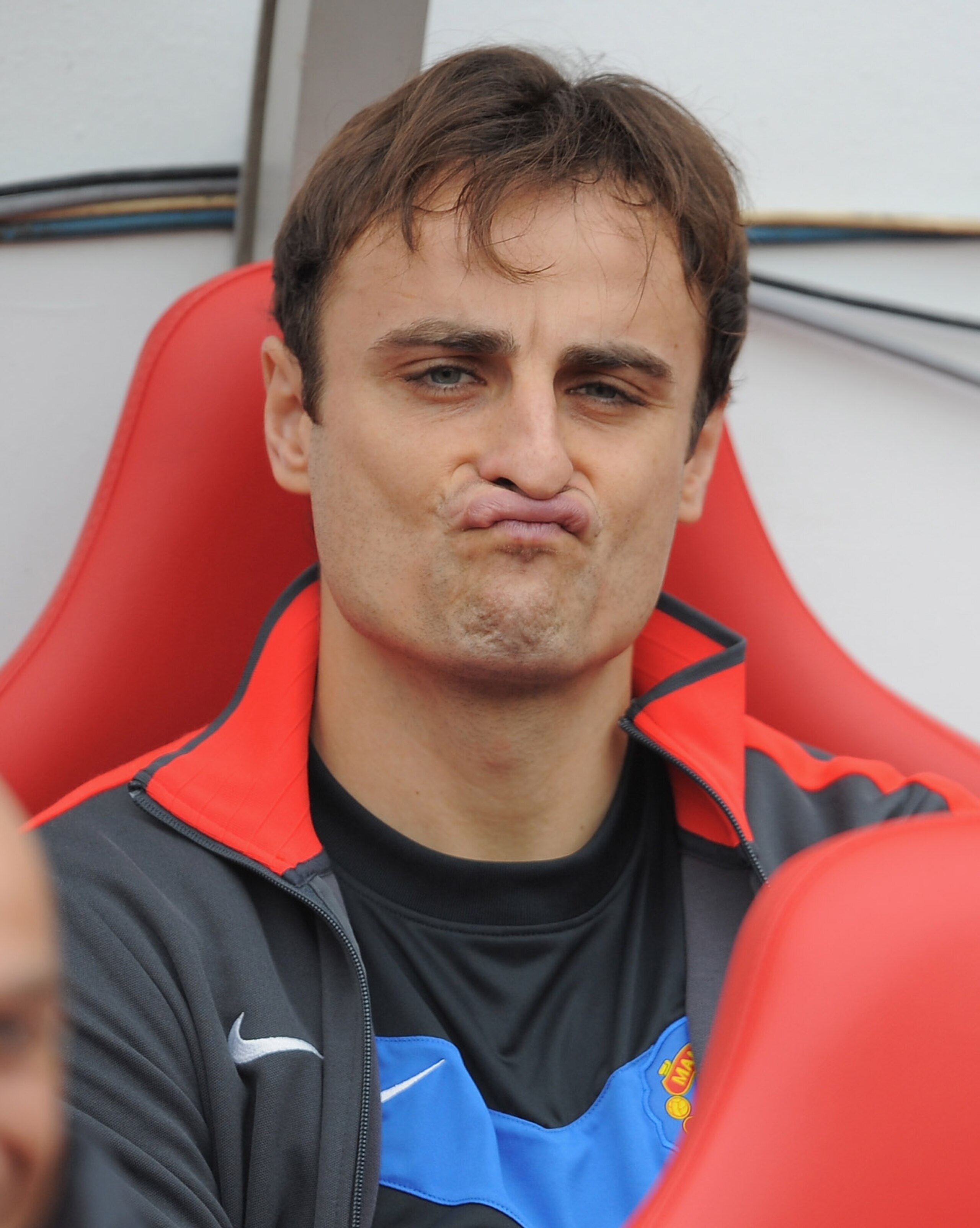SUNDERLAND, ENGLAND - OCTOBER 02: Dimitar Berbatov of Manchester United sits on the bench during the Barclays Premier League match between Sunderland and Manchester United at the Stadium of Light on October 2, 2010 in Sunderland, England.  (Photo by Micha