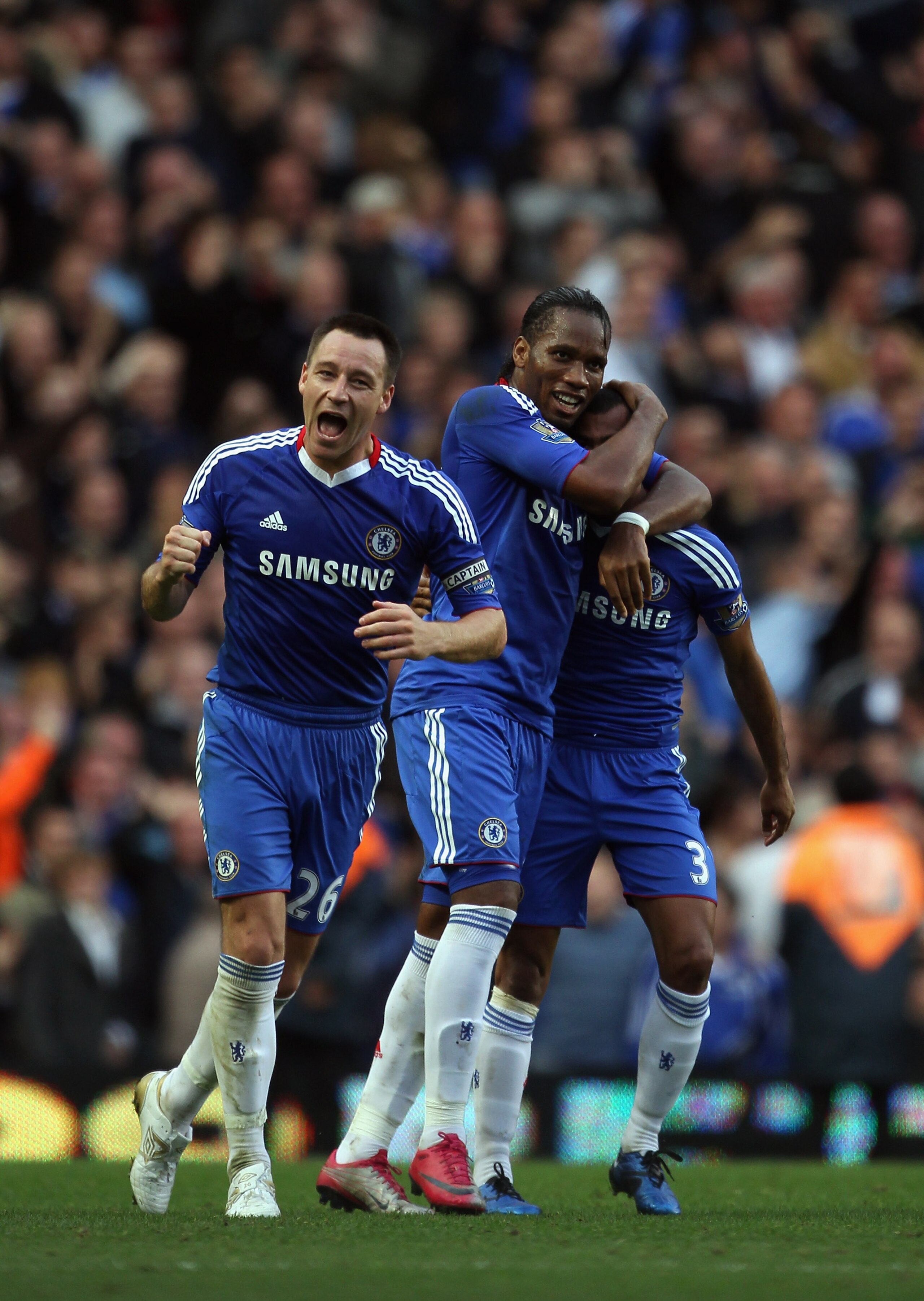 LONDON, ENGLAND - OCTOBER 03:  John Terry, Didier Drogba and Ashley Cole of Chelsea celebrate after team mate Alex scored during the Barclays Premier League match between Chelsea and Arsenal at Stamford Bridge on October 3, 2010 in London, England.  (Phot