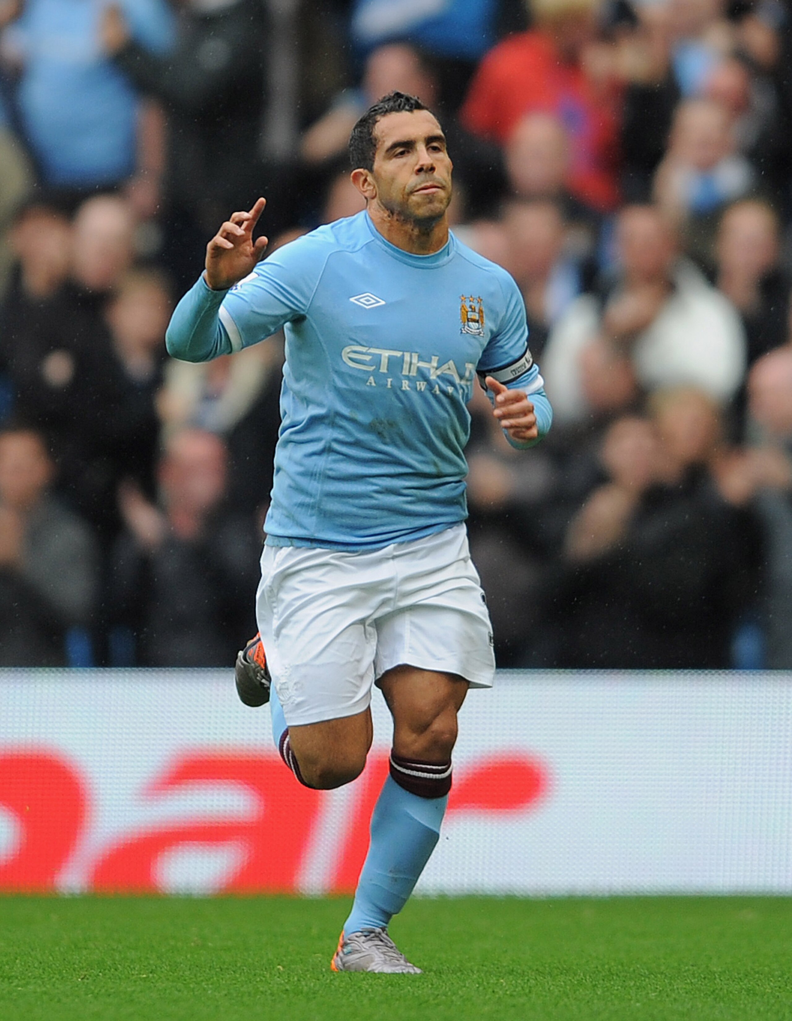 MANCHESTER, ENGLAND - OCTOBER 03:  Carlos Tevez of Manchester City celebrates scoring a penalty to make it 1-0 during the Barclays Premier League match between Manchester City and Newcastle United at the City of Manchester Stadium on October 3, 2010 in Ma