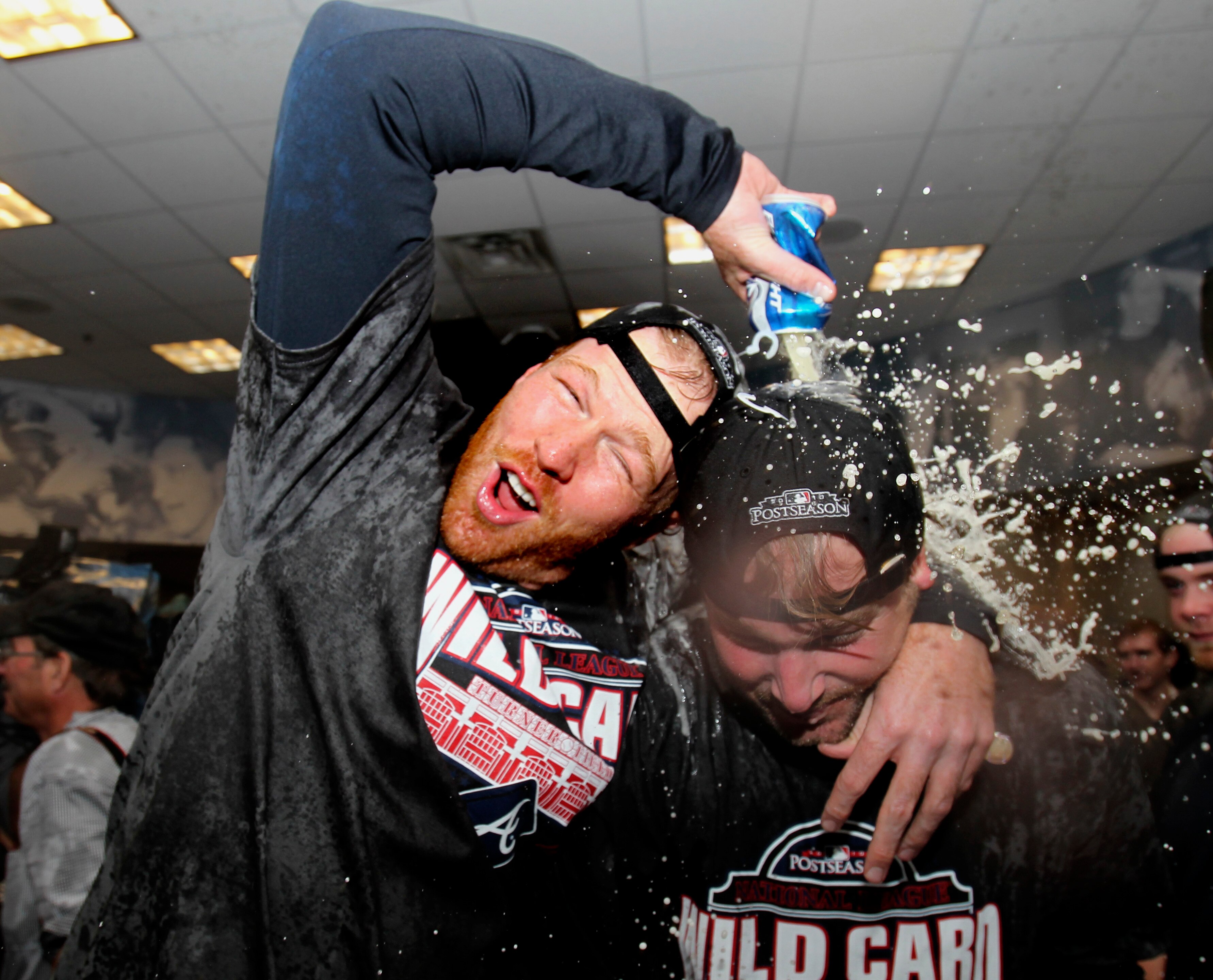 ATLANTA - OCTOBER 03:  Pitcher Tommy Hanson #48 of the Atlanta Braves (left) celebrates with teammate Derek Lowe #32 of the Atlanta Braves after the Braves clinch the National League Wildcard after the game against the Philadelphia Phillies at Turner Fiel