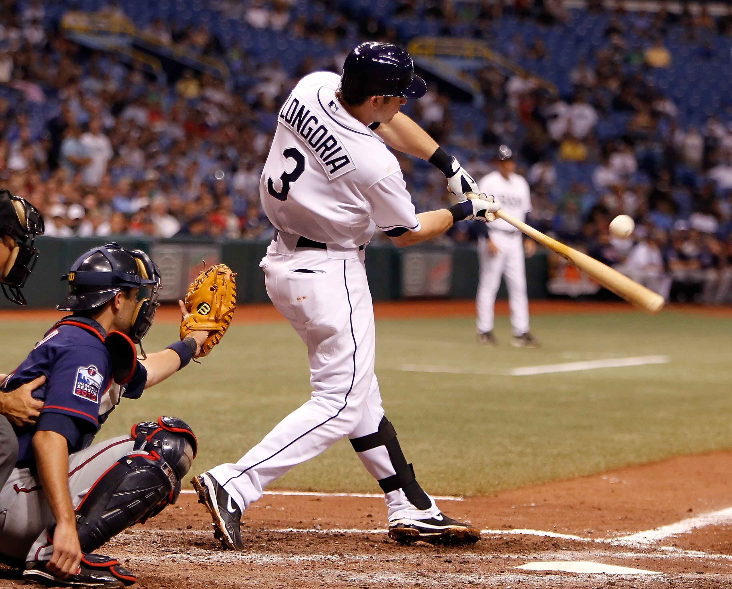 ST. PETERSBURG - AUGUST 04:  Infielder Evan Longoria #3 of the Tampa Bay Rays gets a hit against the Minnesota Twins during the game at Tropicana Field on August 4, 2010 in St. Petersburg, Florida.  (Photo by J. Meric/Getty Images)