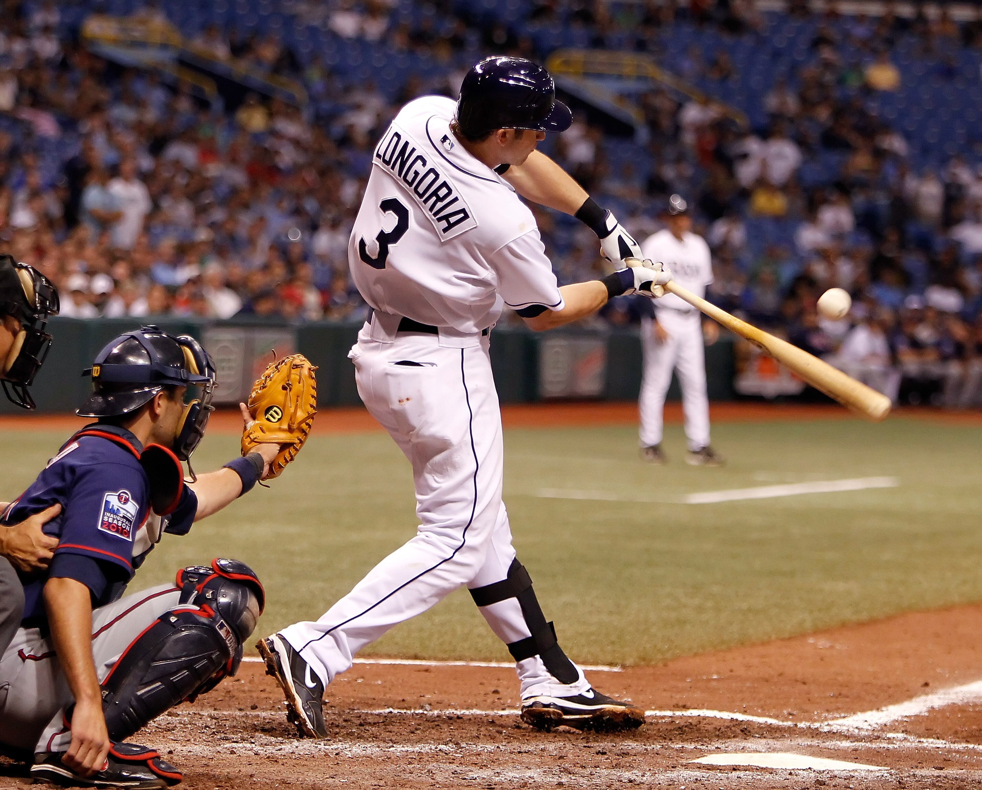ST. PETERSBURG - AUGUST 04:  Infielder Evan Longoria #3 of the Tampa Bay Rays gets a hit against the Minnesota Twins during the game at Tropicana Field on August 4, 2010 in St. Petersburg, Florida.  (Photo by J. Meric/Getty Images)
