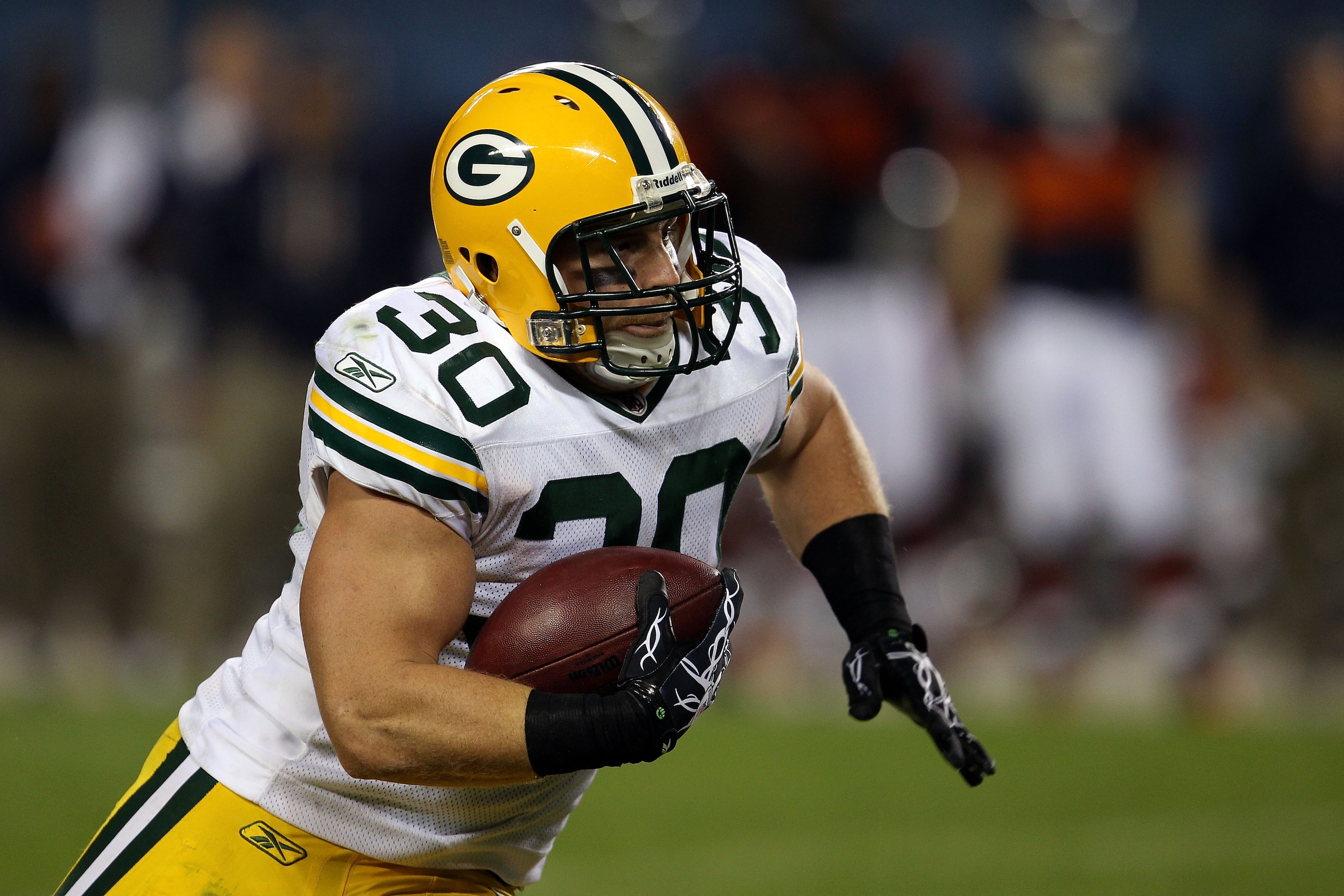 CHICAGO - SEPTEMBER 27: John Kuhn #30 of the Green Bay Packers runs the ball against the Chicago Bears at Soldier Field on September 27, 2010 in Chicago, Illinois. (Photo by Jonathan Daniel/Getty Images) CHICAGO - SEPTEMBER 27: John Kuhn #30 of the Green Bay Packers runs the ball against the Chicago Bears at Soldier Field on September 27, 2010 in Chicago, Illinois. (Photo by Jonathan Daniel/Getty Images)