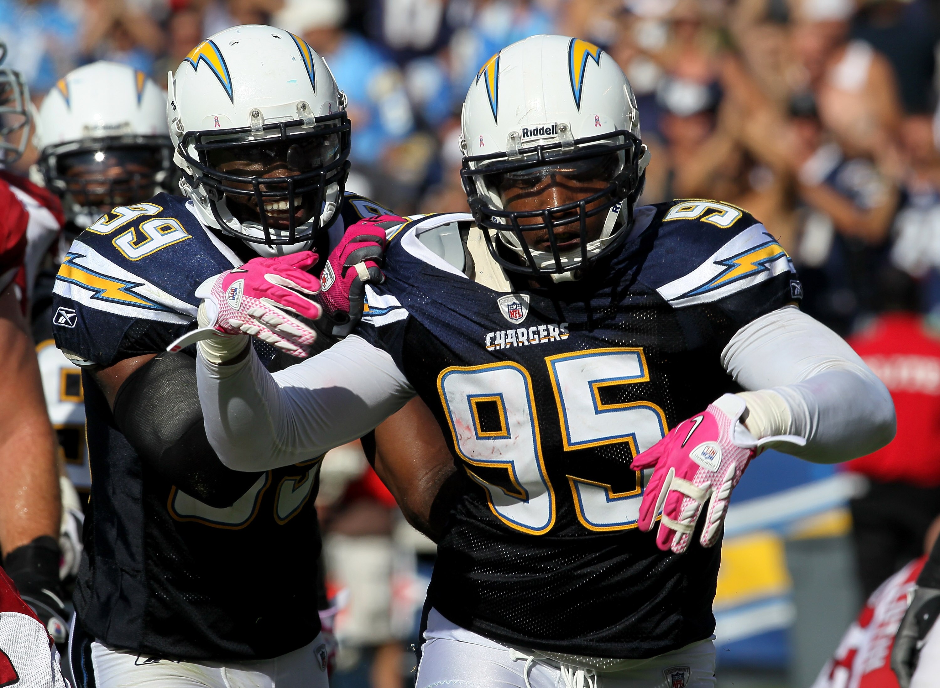 SAN DIEGO - OCTOBER 3: Linebackers Shaun Phillips #95 and Kevin Burnett #99 of the San Diego Chargers celebrate a Phillips sack against the Arizona Cardinals at Qualcomm Stadium on October 3, 2010 in San Diego, California.   The Chargers won 41-10.  (Phot