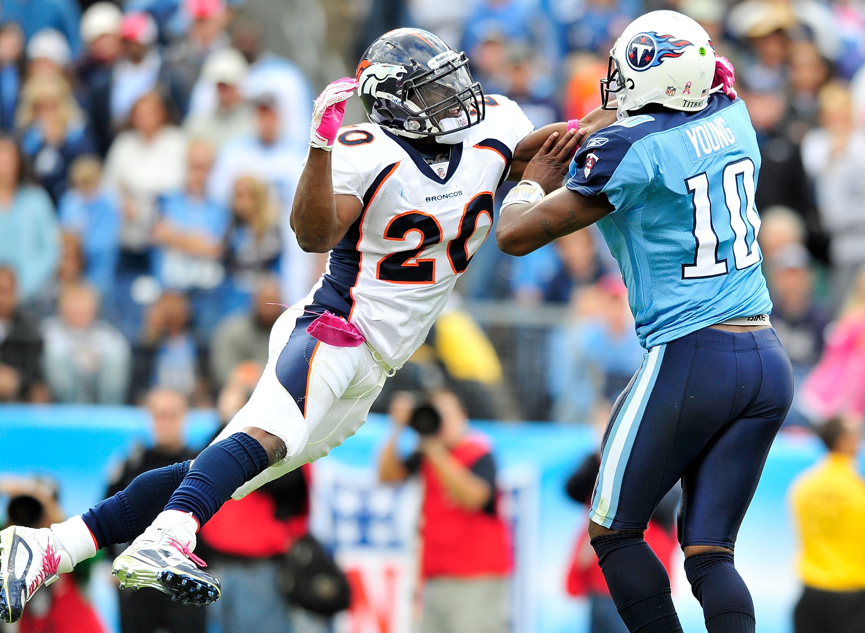 NASHVILLE, TN - OCTOBER 03:  Brian Dawkins #20 of the Denver Broncos pressures quarterback Vince Young #10 of the Tennessee Titans at LP Field on October 3, 2010 in Nashville, Tennessee. Denver won 26-20.  (Photo by Grant Halverson/Getty Images)