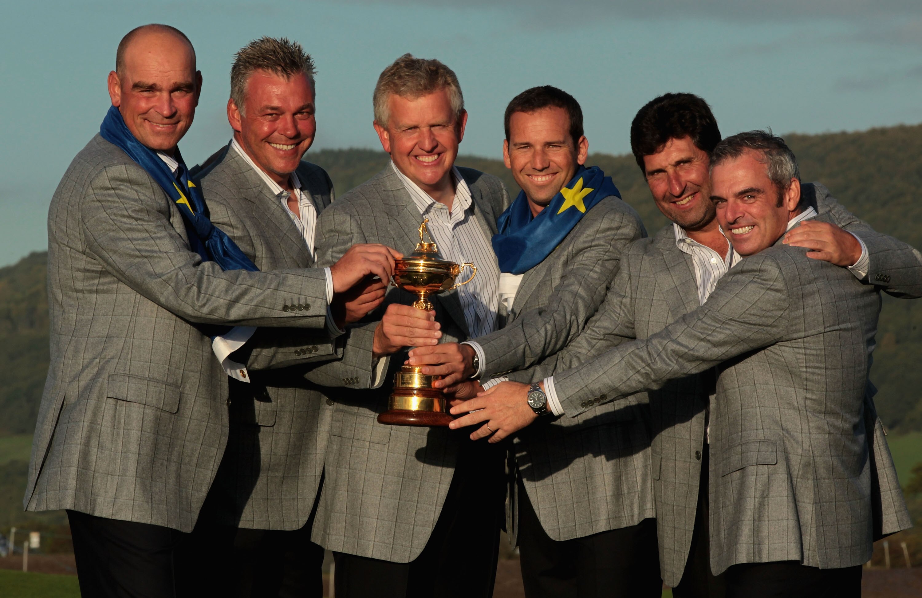 NEWPORT, WALES - OCTOBER 04:  European Team Captain Colin Montgomerie (C) poses with the Ryder Cup and his vice captains (L-R) Thomas Bjorn, Darren Clarke, Sergio Garcia, Jose Maria Olazabal and Paul McGinley following Europe's 14.5 to 13.5 victory over t