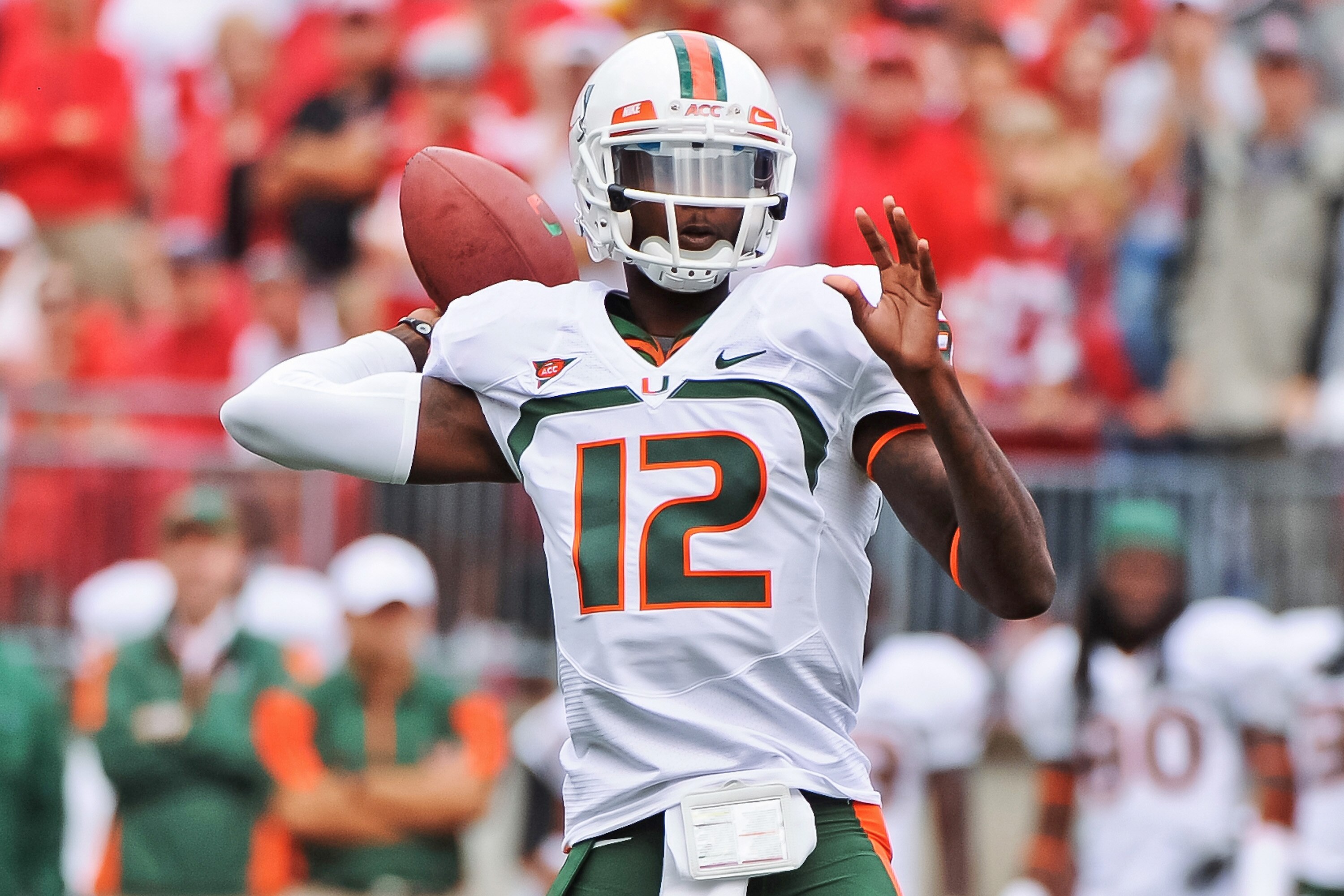 COLUMBUS, OH - SEPTEMBER 11:  Quarterback Jacory Harris #12 of the Miami Hurricanes passes the ball against the Ohio State Buckeyes at Ohio Stadium on September 11, 2010 in Columbus, Ohio.  (Photo by Jamie Sabau/Getty Images)