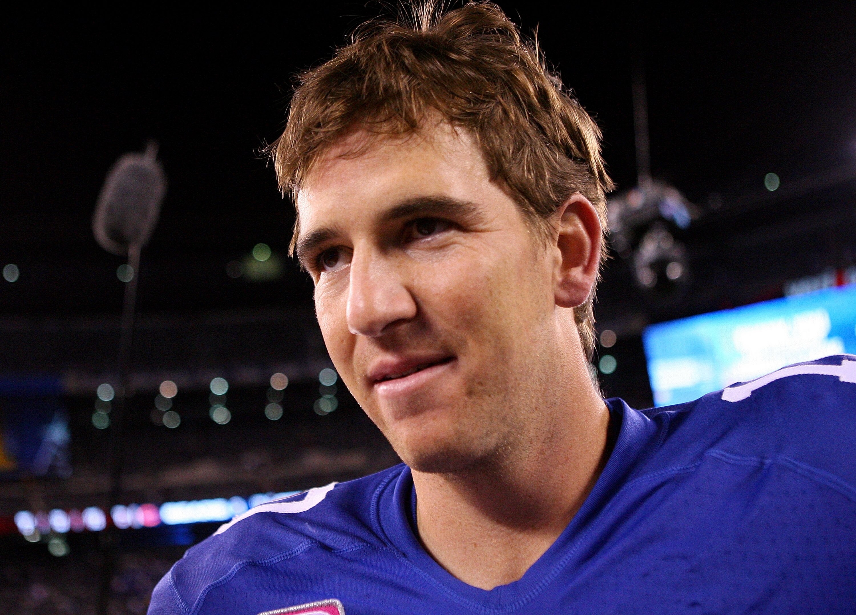 EAST RUTHERFORD, NJ - OCTOBER 03:  Eli Manning #10 of the New York Giants walks off of the field after defeating the Chicago Bears at New Meadowlands Stadium on October 3, 2010 in East Rutherford, New Jersey.  (Photo by Andrew Burton/Getty Images)