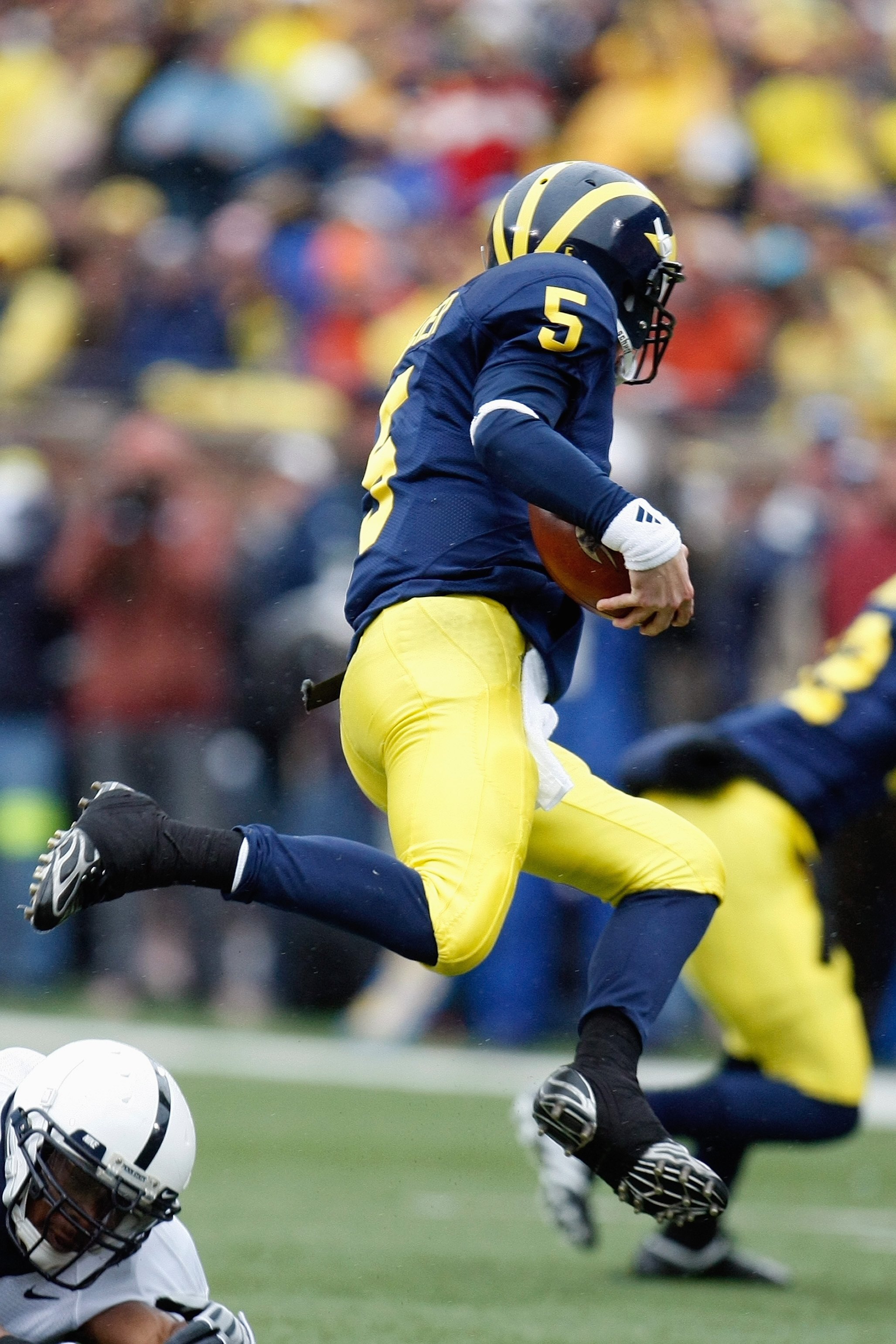 ANN ARBOR, MI - OCTOBER 24:  Tate Forcier #5 of the Michigan Wolverines carries the ball during the game against the Penn State Nittany Lions on October 24, 2009 at Michigan Stadium in Ann Arbor, Michigan. (Photo by  Gregory Shamus/Getty Images)