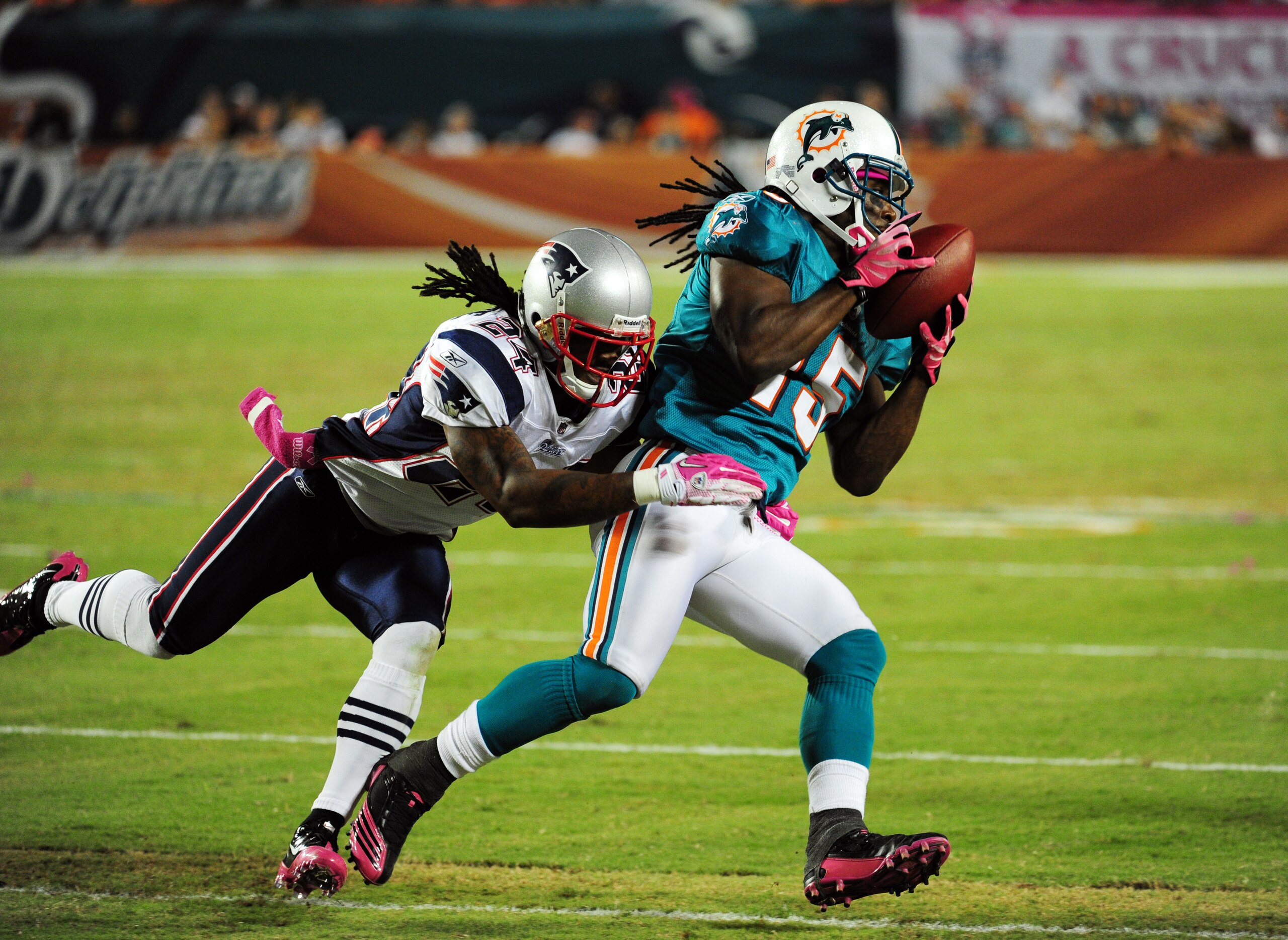 MIAMI - OCTOBER 4: Davone Bess #15 of the Miami Dolphins makes a catch against Jonathan Wilhite #24 of the New England Patriots at Sun Life Field on October 4, 2010 in Miami, Florida. (Photo by Scott Cunningham/Getty Images)