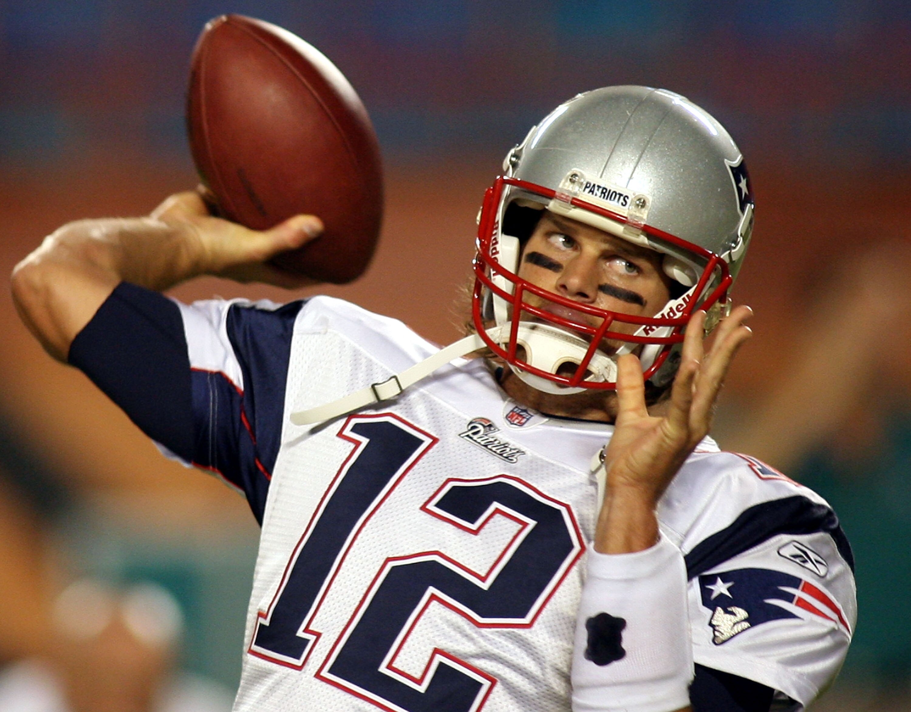 MIAMI - OCTOBER 04:  Quarterback Tom Brady #12 of the New England Patriots warms up against the Miami Dolphins at Sun Life Stadium on October 4, 2010 in Miami, Florida.  (Photo by Marc Serota/Getty Images)