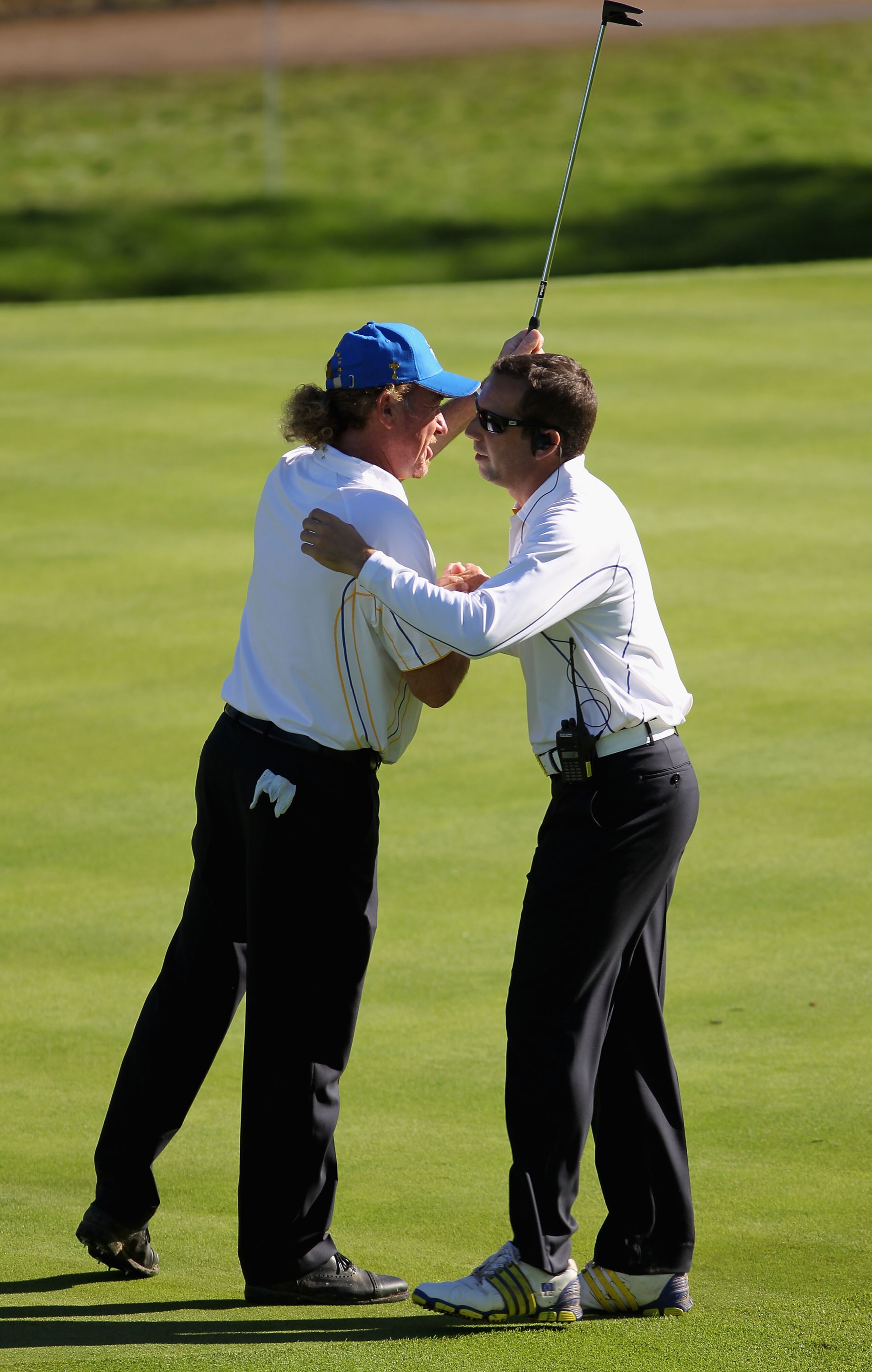 NEWPORT, WALES - OCTOBER 04: Miguel Angel Jimenez (L) of Europe hugs Sergio Garcia on the 15th green in the singles matches during the 2010 Ryder Cup at the Celtic Manor Resort on October 4, 2010 in Newport, Wales. (Photo by Jamie Squire/Getty Images) NEWPORT, WALES - OCTOBER 04: Miguel Angel Jimenez (L) of Europe hugs Sergio Garcia on the 15th green in the singles matches during the 2010 Ryder Cup at the Celtic Manor Resort on October 4, 2010 in Newport, Wales. (Photo by Jamie Squire/Getty Images)