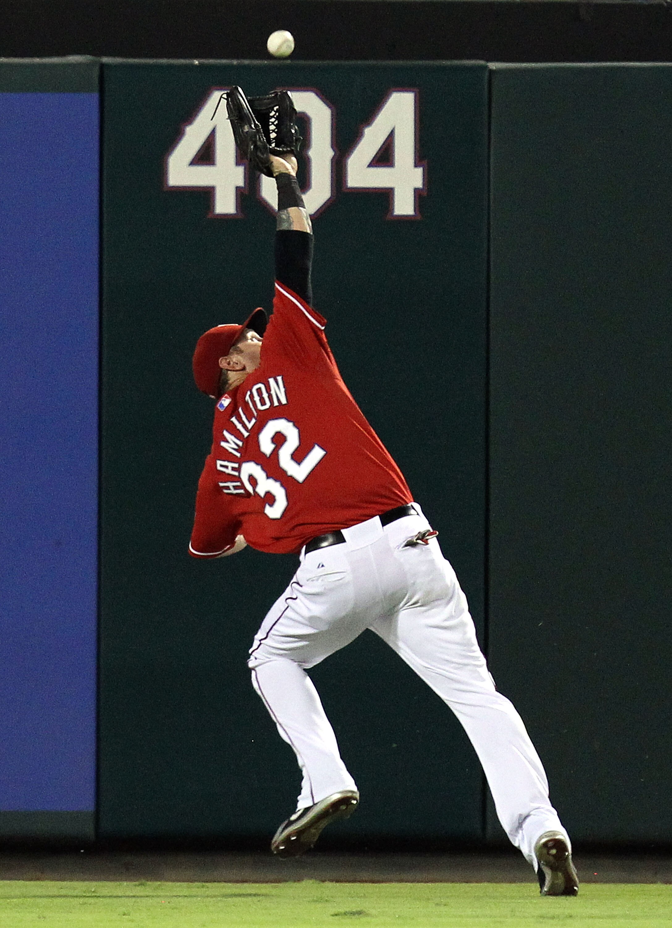 ARLINGTON, TX - OCTOBER 01:  Left fielder Josh Hamilton #32 of the Texas Rangers makes the fly out against Torii Hunter #48 of the Los Angeles Angels of Anaheim at Rangers Ballpark in Arlington on October 1, 2010 in Arlington, Texas.  (Photo by Ronald Mar