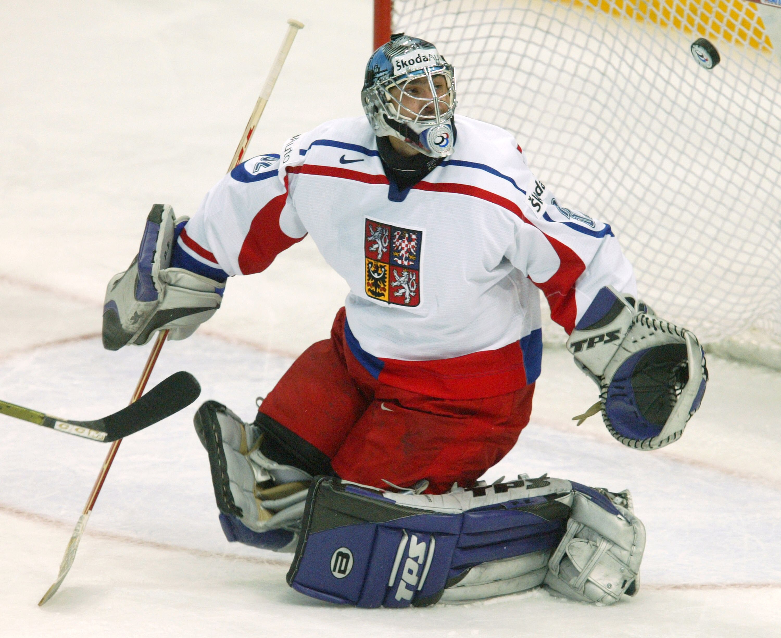 PRAGUE, CZECH REPUBLIC - MAY 2:  Goalie Roman Cechmanek of the Czech Republic deflects a Switzerland shot on goal in the teams' Group E qualifier match at the International Ice Hockey Federation World Championship May 2, 2004 in Prague, Czech Republic.  T