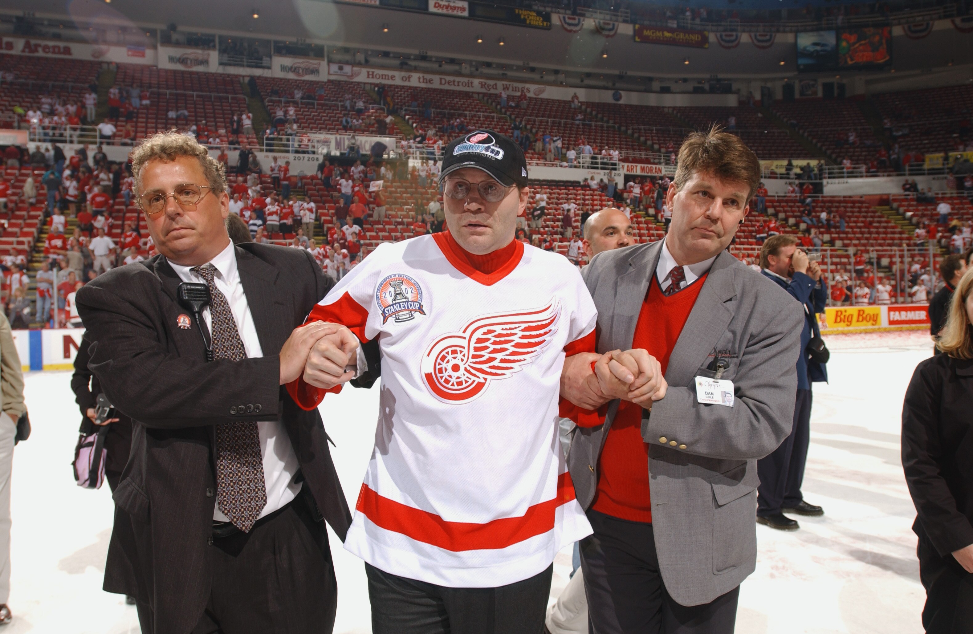 DETROIT, MI - JUNE 13:  Former Red Wing Vladimir Konstantinov is helped across the ice as Detroit celebrates winning the Stanley Cup after defeating the Carolina Hurricanes during game five of the NHL Stanley Cup Finals on June 13, 2002 at the Joe Louis A