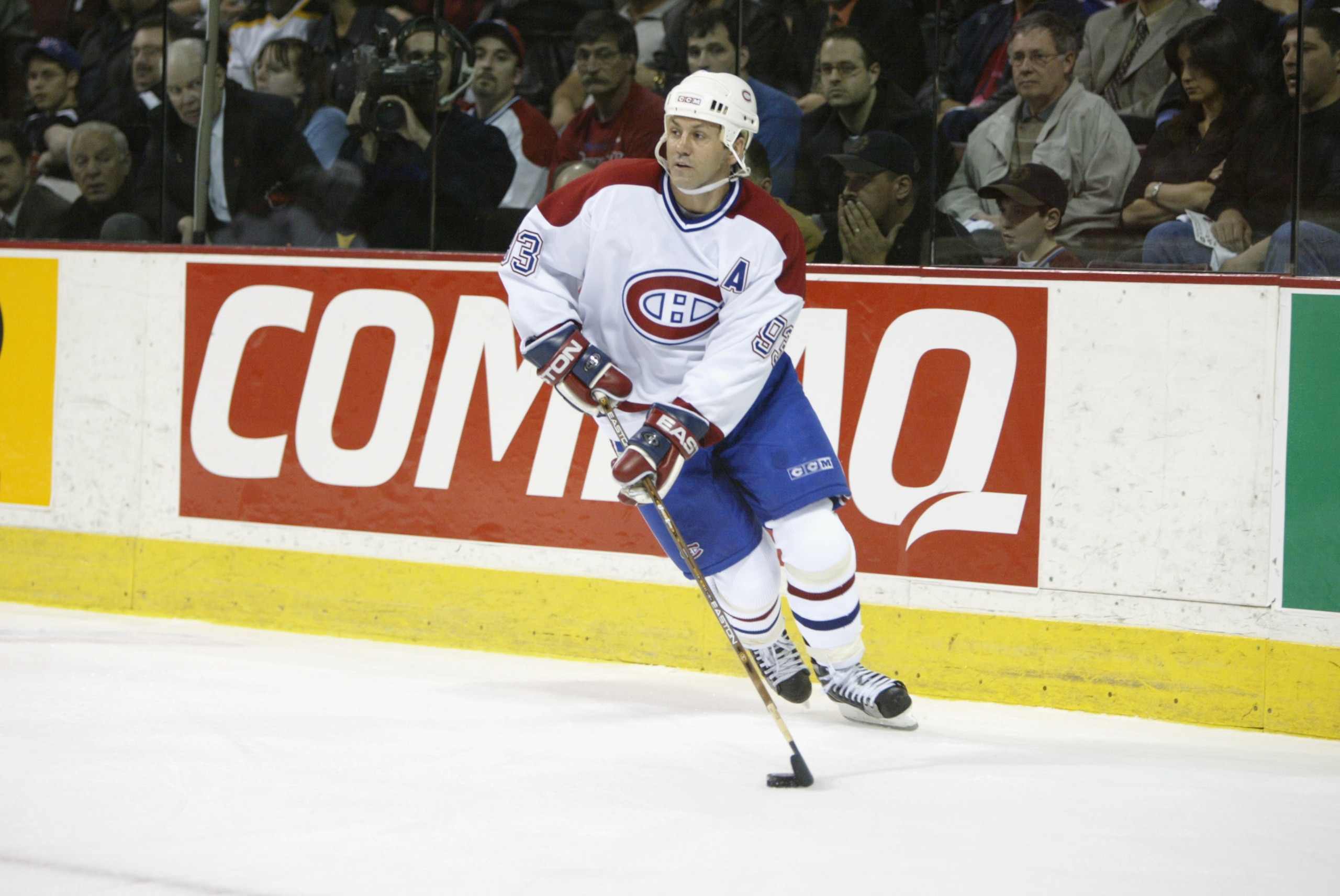 MONTREAL - APRIL 25:  Center Doug Gilmour #93 of the Montreal Canadiens skates with the puck during game four of the Stanley Cup playoffs against the Boston Bruins at the Molson Center in Montreal, Canada on April 25, 2002. The Bruins won 5-2.  (Photo by 