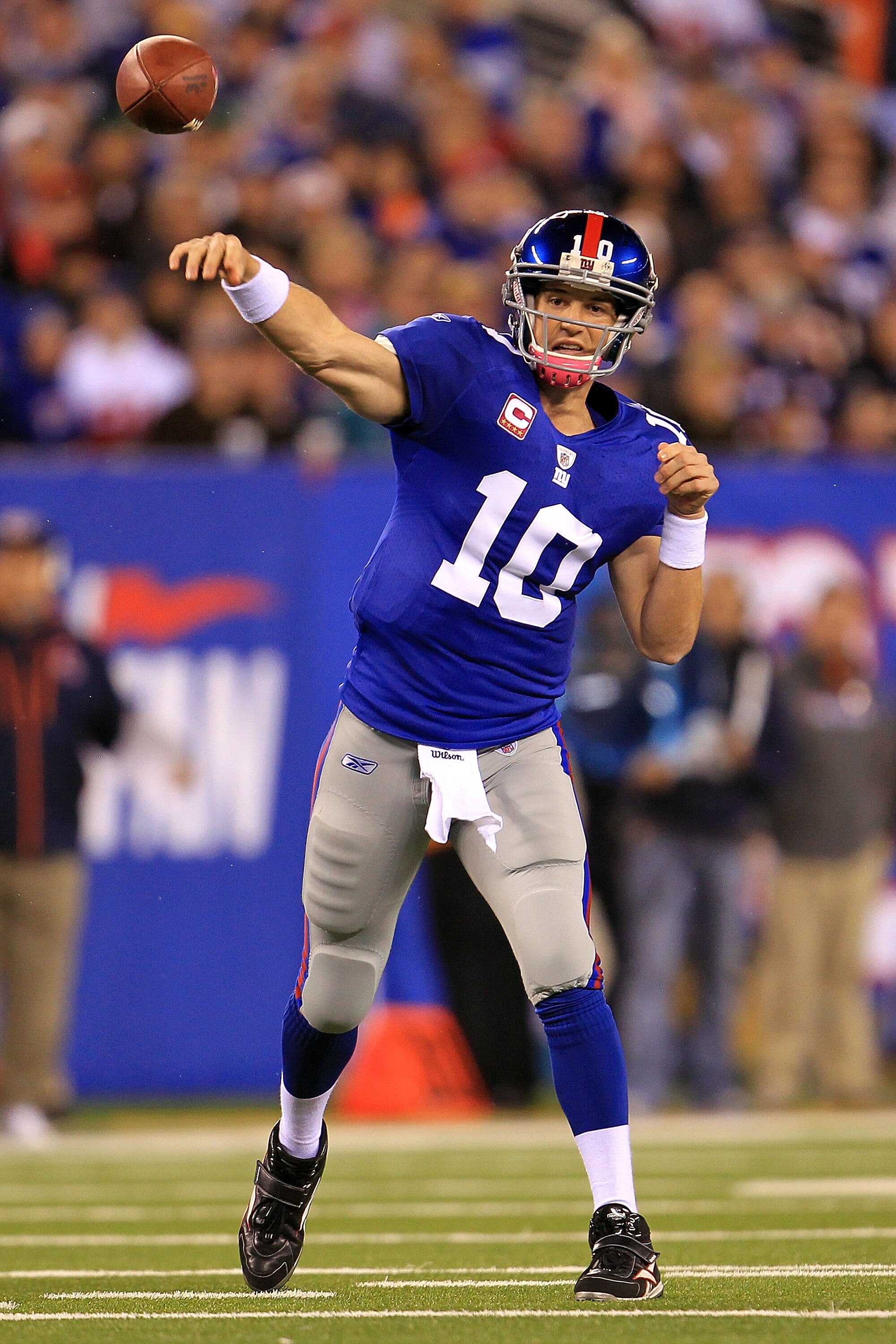 EAST RUTHERFORD, NJ - OCTOBER 03:  Eli Manning #10 of the New York Giants drops back to pass against the Chicago Bears at New Meadowlands Stadium on October 3, 2010 in East Rutherford, New Jersey.  (Photo by Chris McGrath/Getty Images)