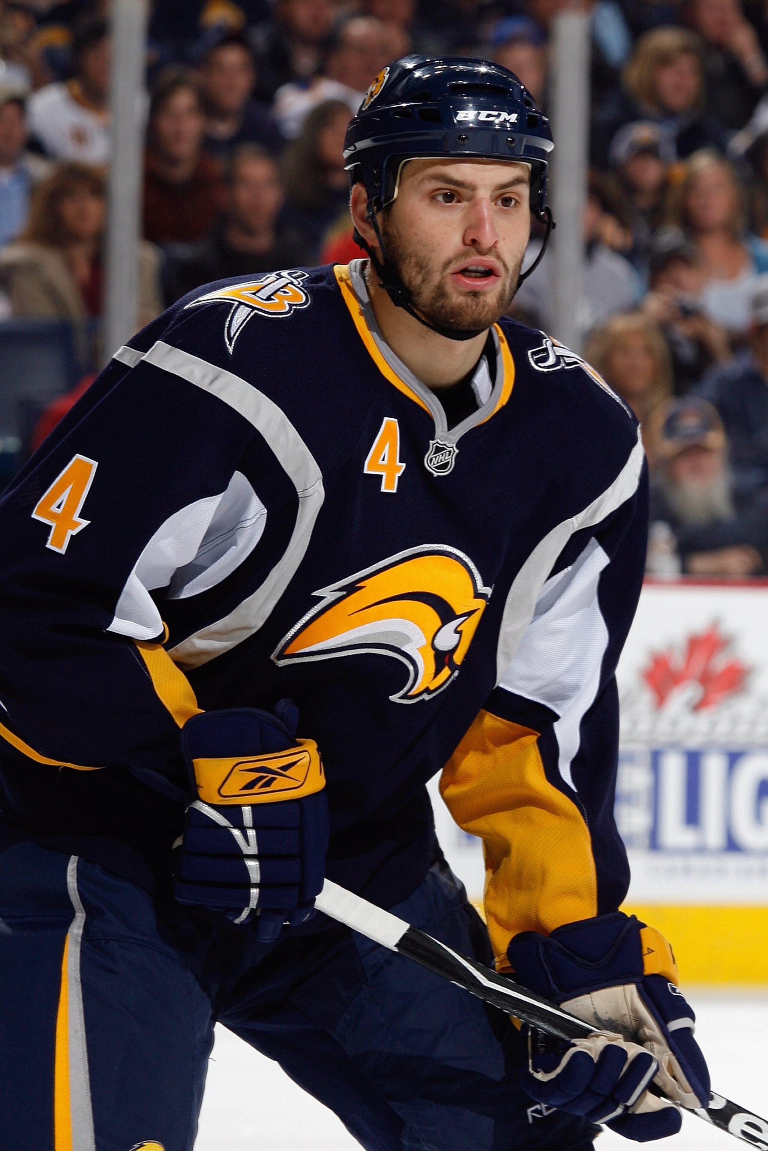 BUFFALO, NY - OCTOBER 30:  Mike Weber #4 of the Buffalo Sabres eyes the play during the game against the Tampa Bay Lightning on October 30, 2008 at HSBC Arena in Buffalo, New York. (Photo by Rick Stewart/Getty Images)