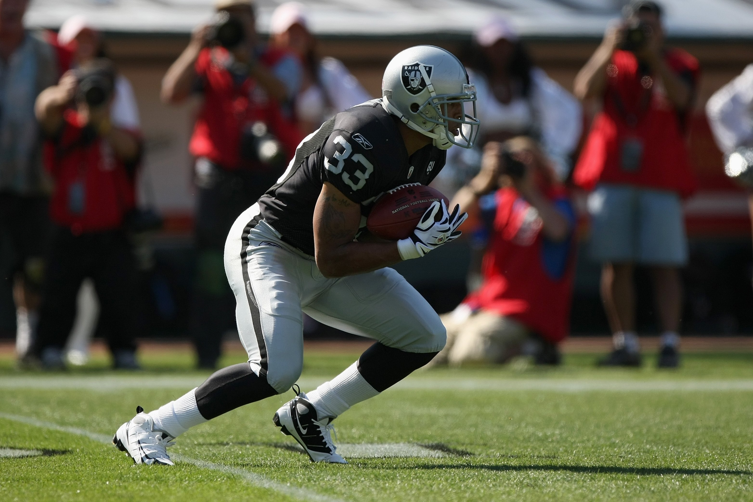 OAKLAND, CA - OCTOBER 19:  Tyvon Branch #33 of the Oakland Raiders returns a kick during the game against the New York Jets on October 19, 2008 at the Oakland-Alameda County Coliseum in Oakland, California. (Photo by Jed Jacobsohn/Getty Images)