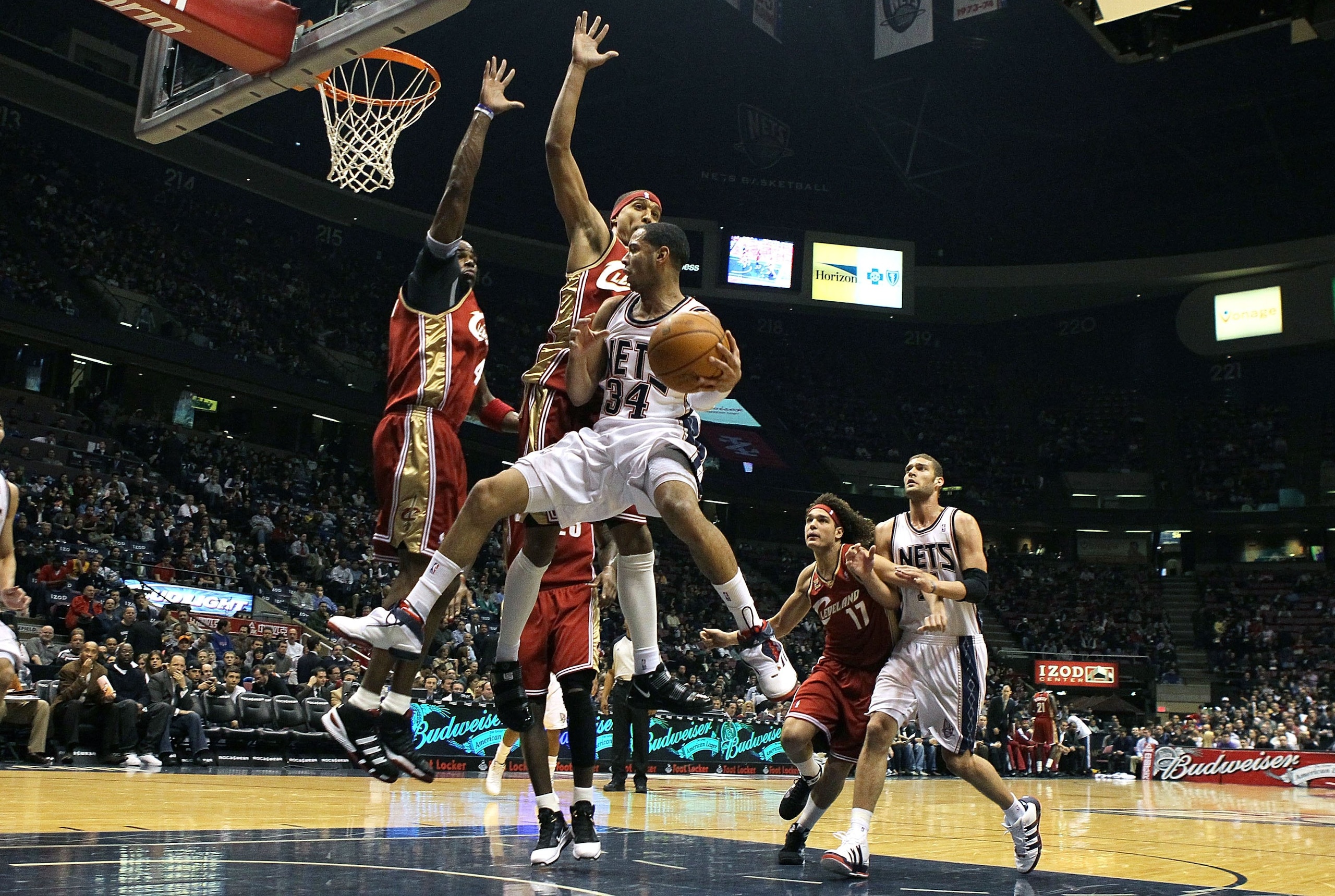 EAST RUTHERFORD, NJ - MARCH 03: Devin Harris #34 of the New Jersey Nets drives to the hoop against the Cleveland Cavaliers at the Izod Center on March 3, 2010 in East Rutherford, New Jersey.NOTE TO USER: User expressly acknowledges and agrees that, by do EAST RUTHERFORD, NJ - MARCH 03: Devin Harris #34 of the New Jersey Nets drives to the hoop against the Cleveland Cavaliers at the Izod Center on March 3, 2010 in East Rutherford, New Jersey.NOTE TO USER: User expressly acknowledges and agrees that, by do