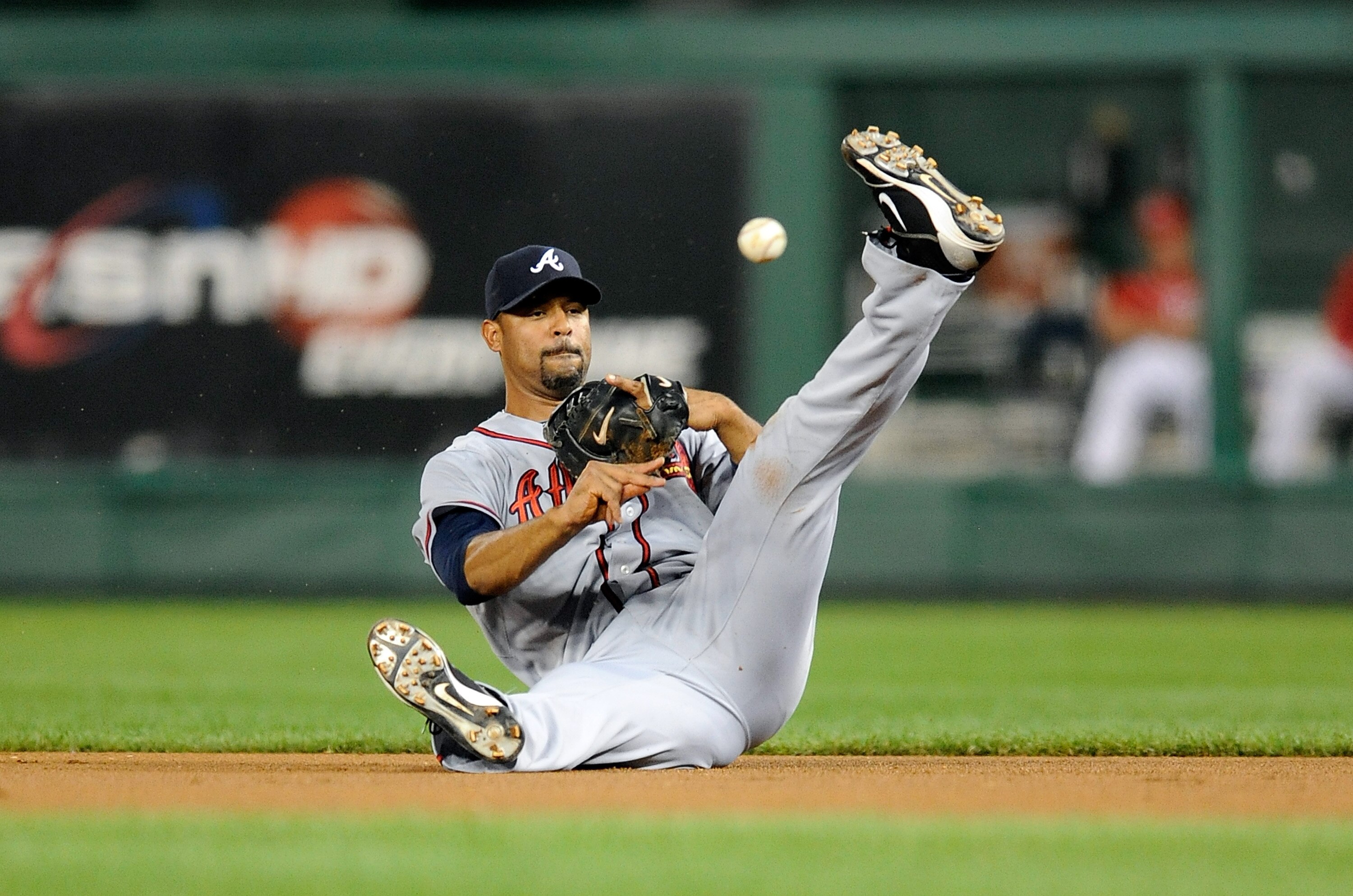 WASHINGTON - SEPTEMBER 24:  Derrek Lee #27 of the Atlanta Braves throws the ball to first base during the game against the Washington Nationals at Nationals Park on September 24, 2010 in Washington, DC.  (Photo by Greg Fiume/Getty Images)