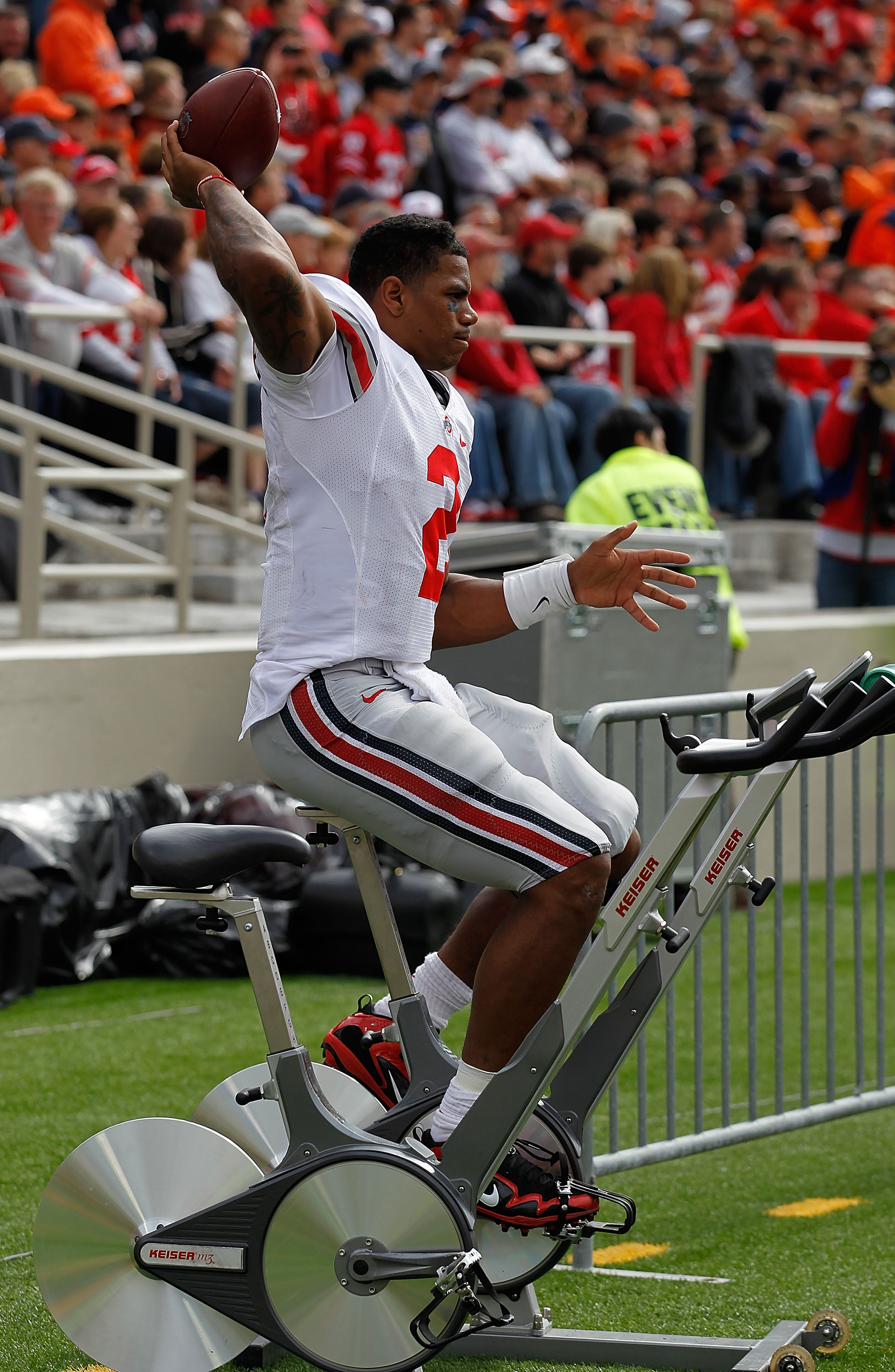 CHAMPAIGN, IL - OCTOBER 02: Terrelle Pryor #2 of the Ohio State Buckeyes throws a football while riding an exercise bicycle on the sidelines after suffering a leg injury against the Illinois Fighting Illini at Memorial Stadium on October 2, 2010 in Champa CHAMPAIGN, IL - OCTOBER 02: Terrelle Pryor #2 of the Ohio State Buckeyes throws a football while riding an exercise bicycle on the sidelines after suffering a leg injury against the Illinois Fighting Illini at Memorial Stadium on October 2, 2010 in Champa