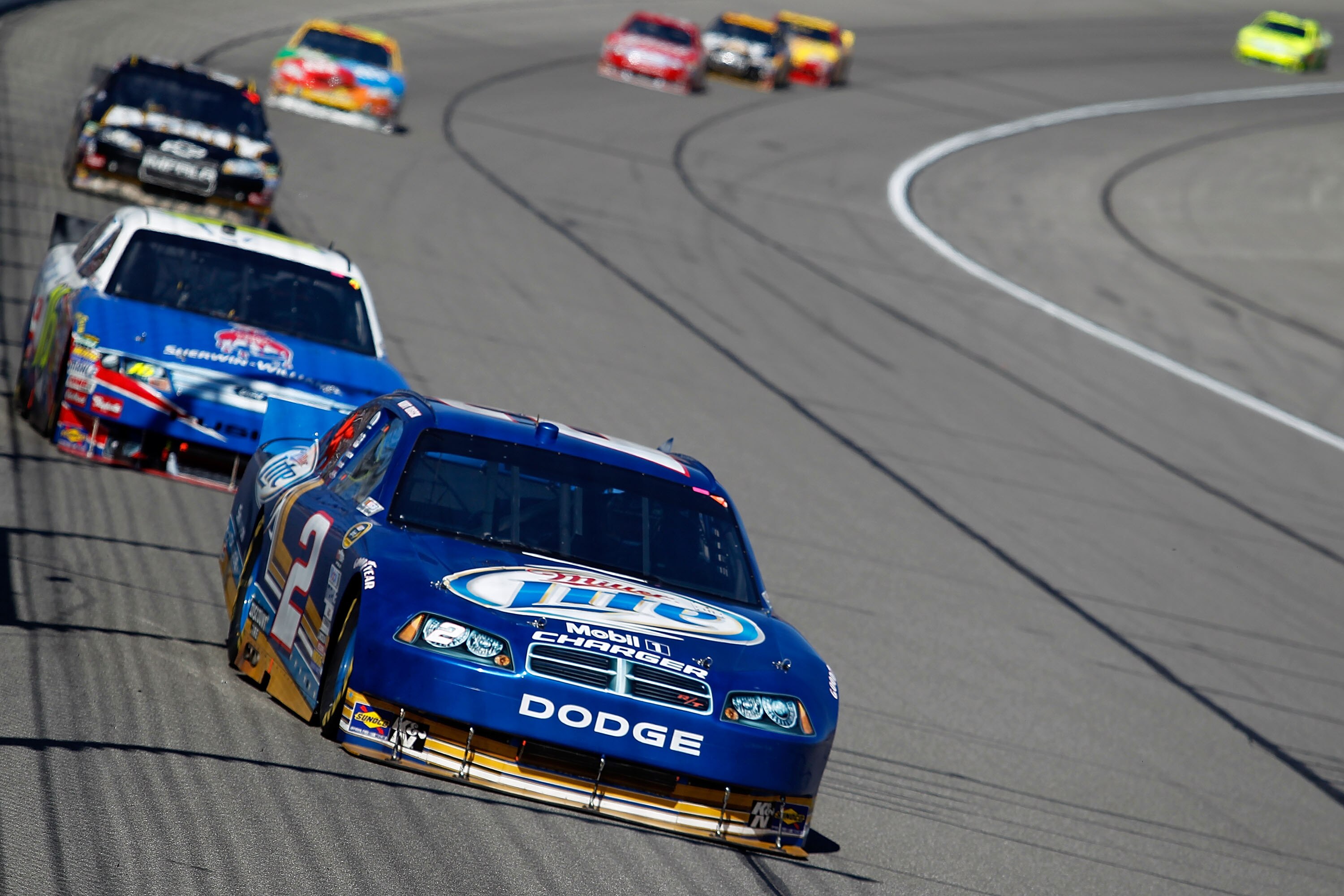 KANSAS CITY, KS - OCTOBER 03:  Kurt Busch, driver of the #2 Miller Lite Dodge, leads a pack of cars during the NASCAR Sprint Cup Series Price Chopper 400 on October 3, 2010 in Kansas City, Kansas.  (Photo by Todd Warshaw/Getty Images)