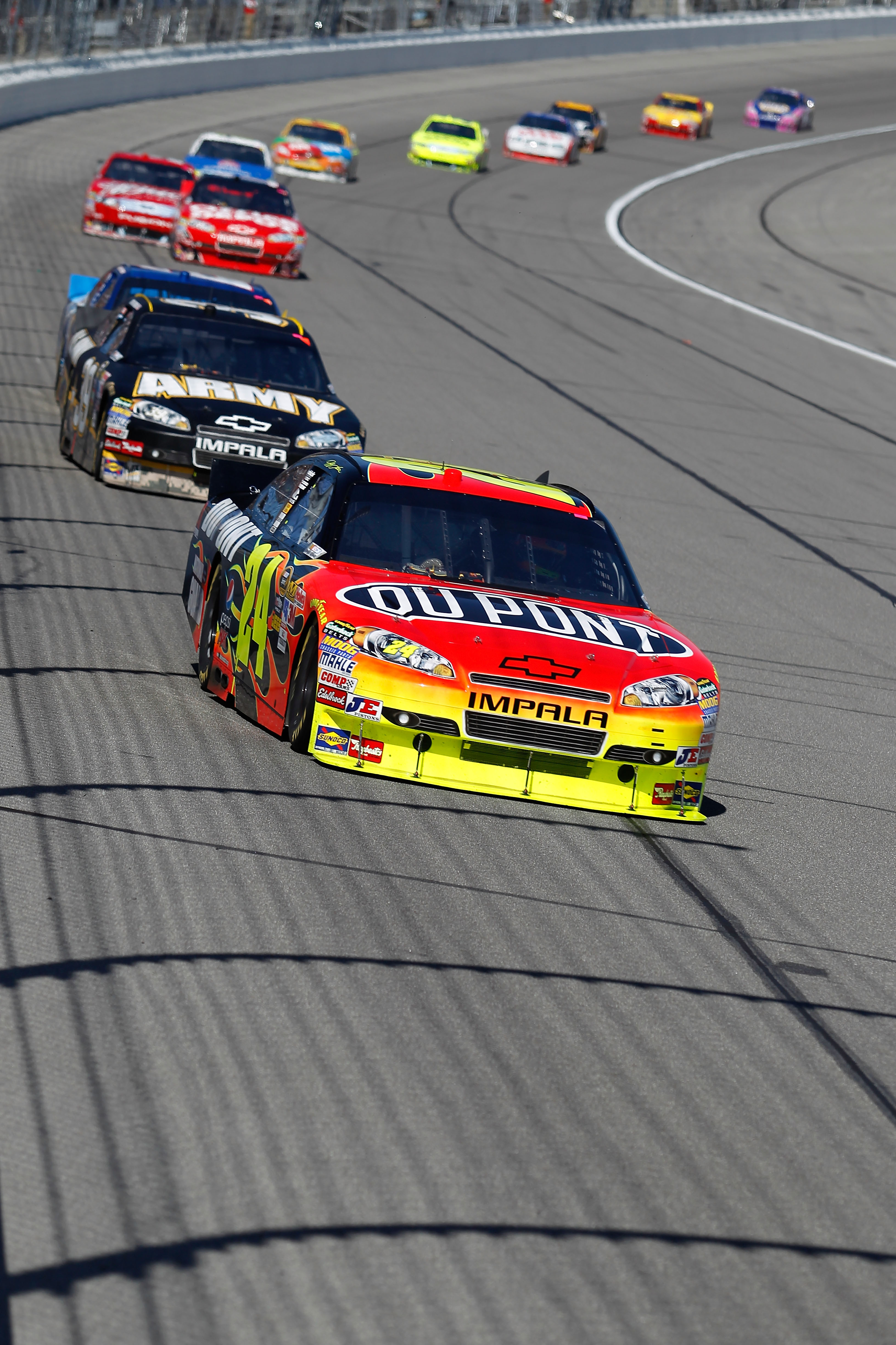 KANSAS CITY, KS - OCTOBER 03:  Jeff Gordon, driver of the #24 DuPont Chevrolet, leads a line of cars during the NASCAR Sprint Cup Series Price Chopper 400 on October 3, 2010 in Kansas City, Kansas.  (Photo by Todd Warshaw/Getty Images)
