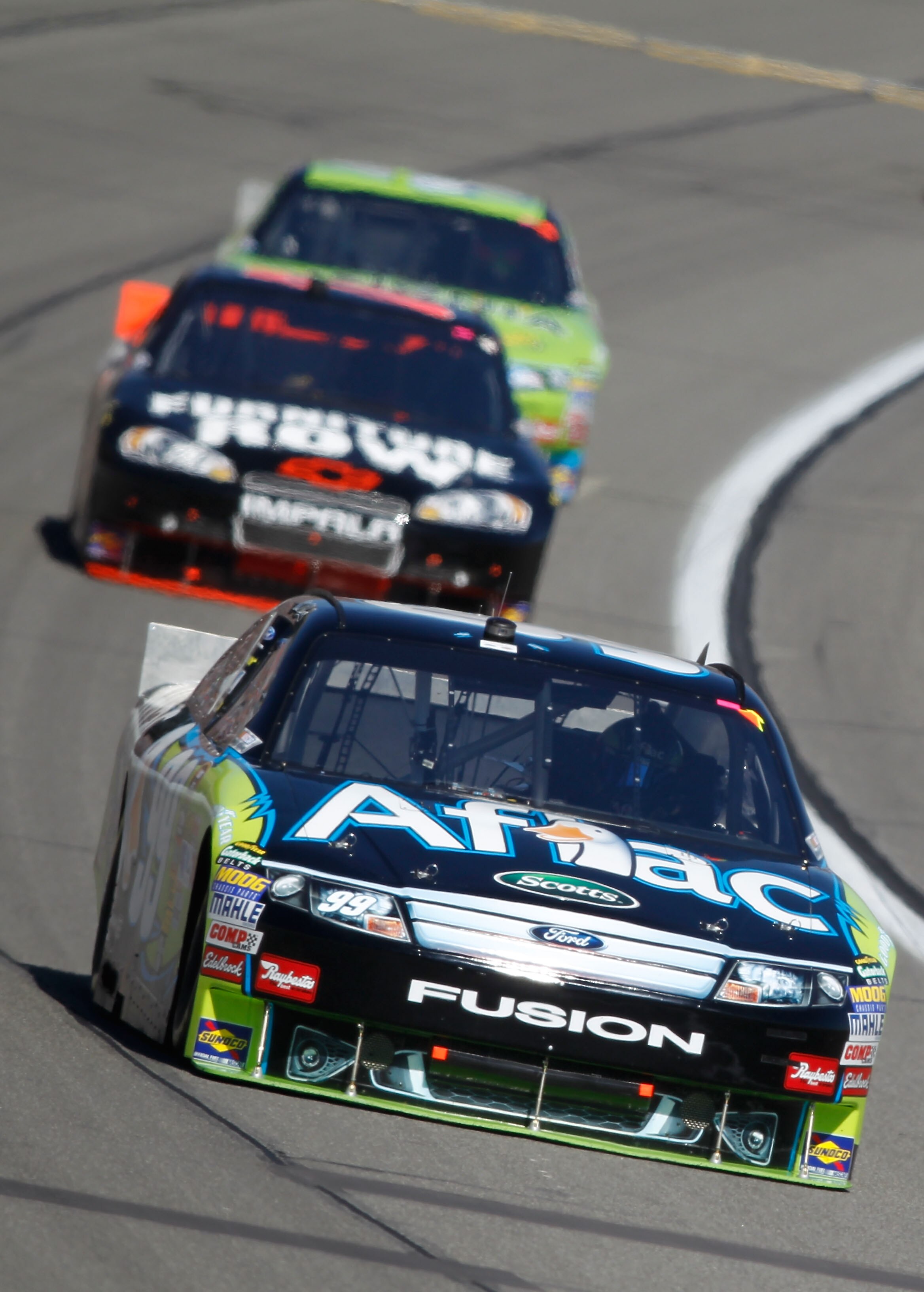 KANSAS CITY, KS - OCTOBER 03:  Carl Edwards, driver of the #99 Aflac Ford, leads a line of cars during the NASCAR Sprint Cup Series Price Chopper 400 on October 3, 2010 in Kansas City, Kansas.  (Photo by Todd Warshaw/Getty Images)
