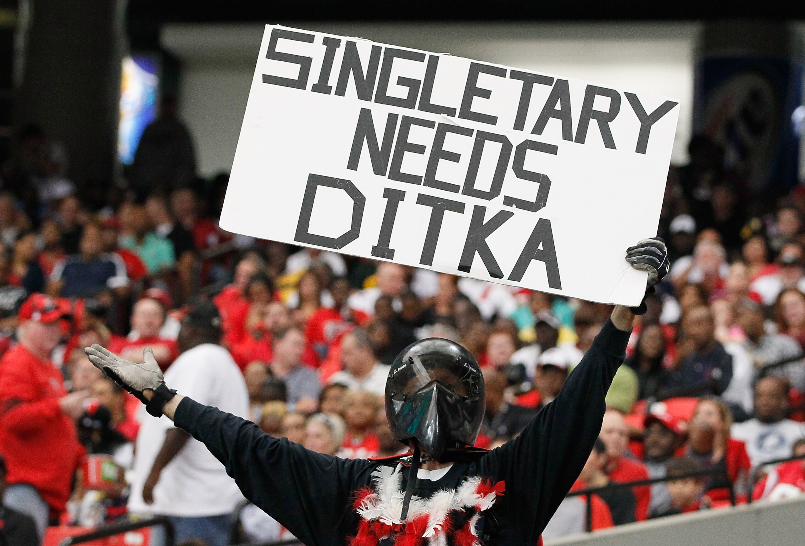 ATLANTA - OCTOBER 03:  A fan of the Atlanta Falcons holds up a sign about Hall of Famer Mike Ditka and head coach Mike Singletary of the San Francisco 49ers at Georgia Dome on October 3, 2010 in Atlanta, Georgia.  (Photo by Kevin C. Cox/Getty Images)