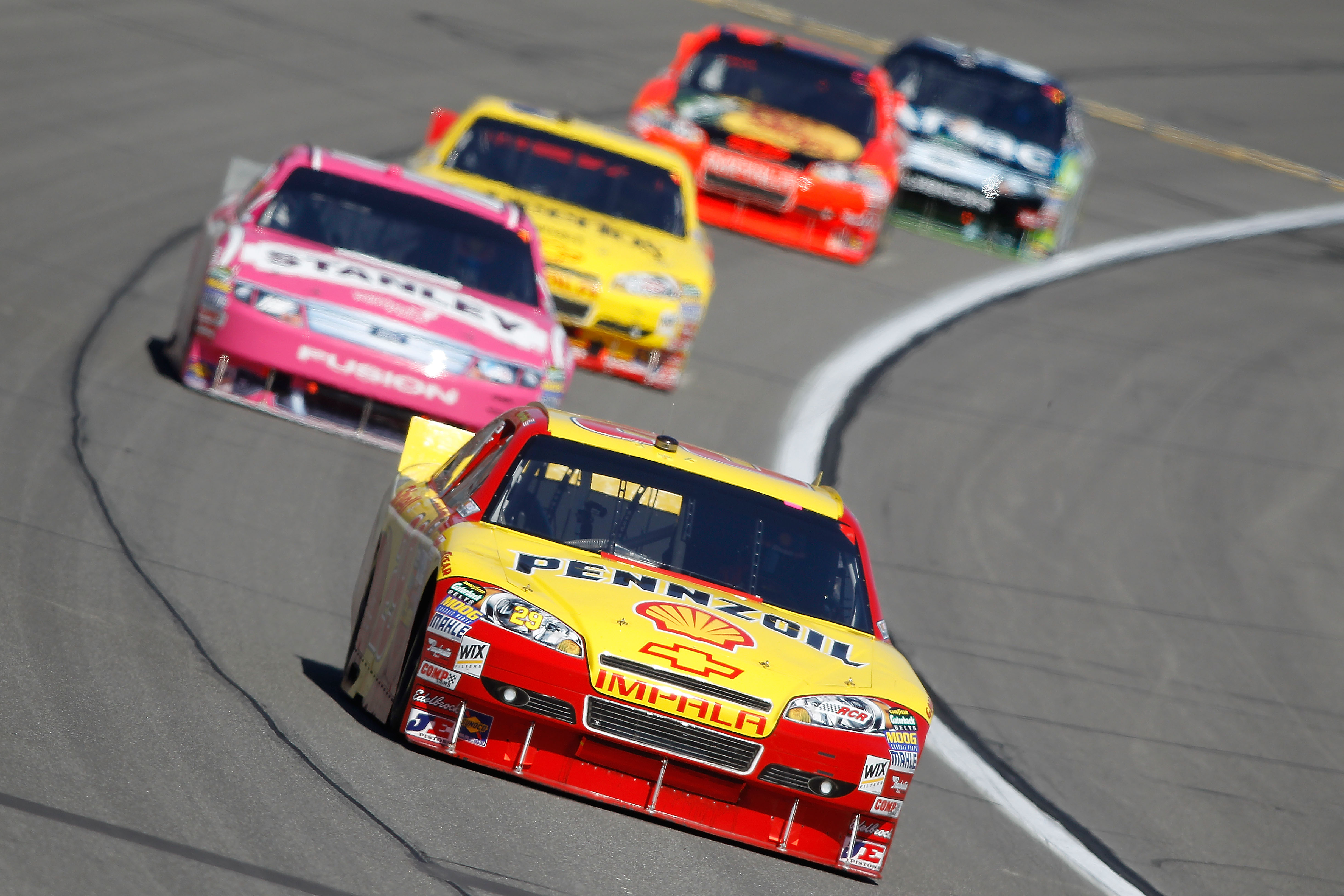 KANSAS CITY, KS - OCTOBER 03:  Kevin Harvick, driver of the #29 Shell/Pennzoil Chevrolet, leads a line of cars during the NASCAR Sprint Cup Series Price Chopper 400 on October 3, 2010 in Kansas City, Kansas.  (Photo by Todd Warshaw/Getty Images)