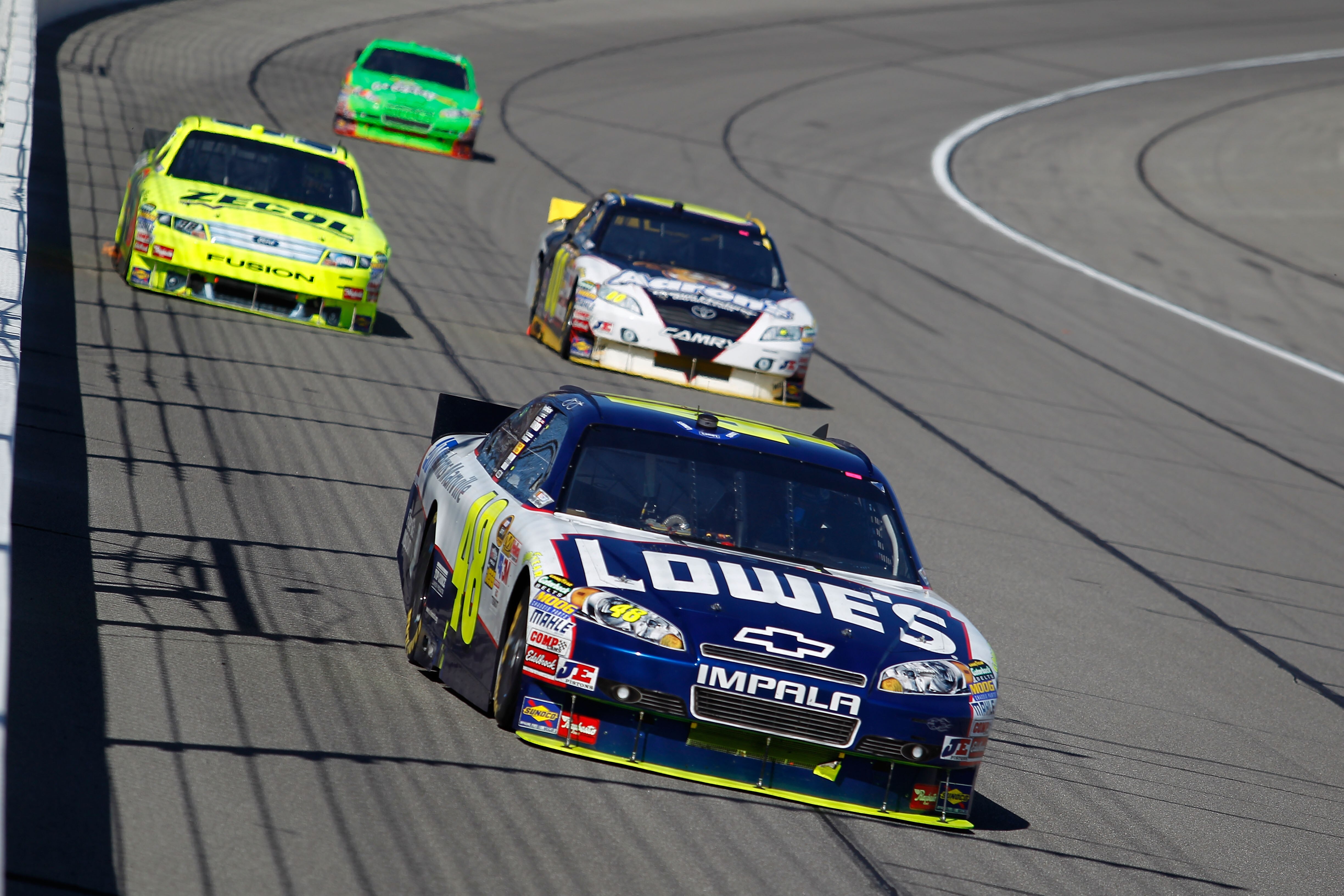 KANSAS CITY, KS - OCTOBER 03:  Jimmie Johnson, driver of the #48 Lowe's Chevrolet, leads a line of cars during the NASCAR Sprint Cup Series Price Chopper 400 on October 3, 2010 in Kansas City, Kansas.  (Photo by Todd Warshaw/Getty Images)