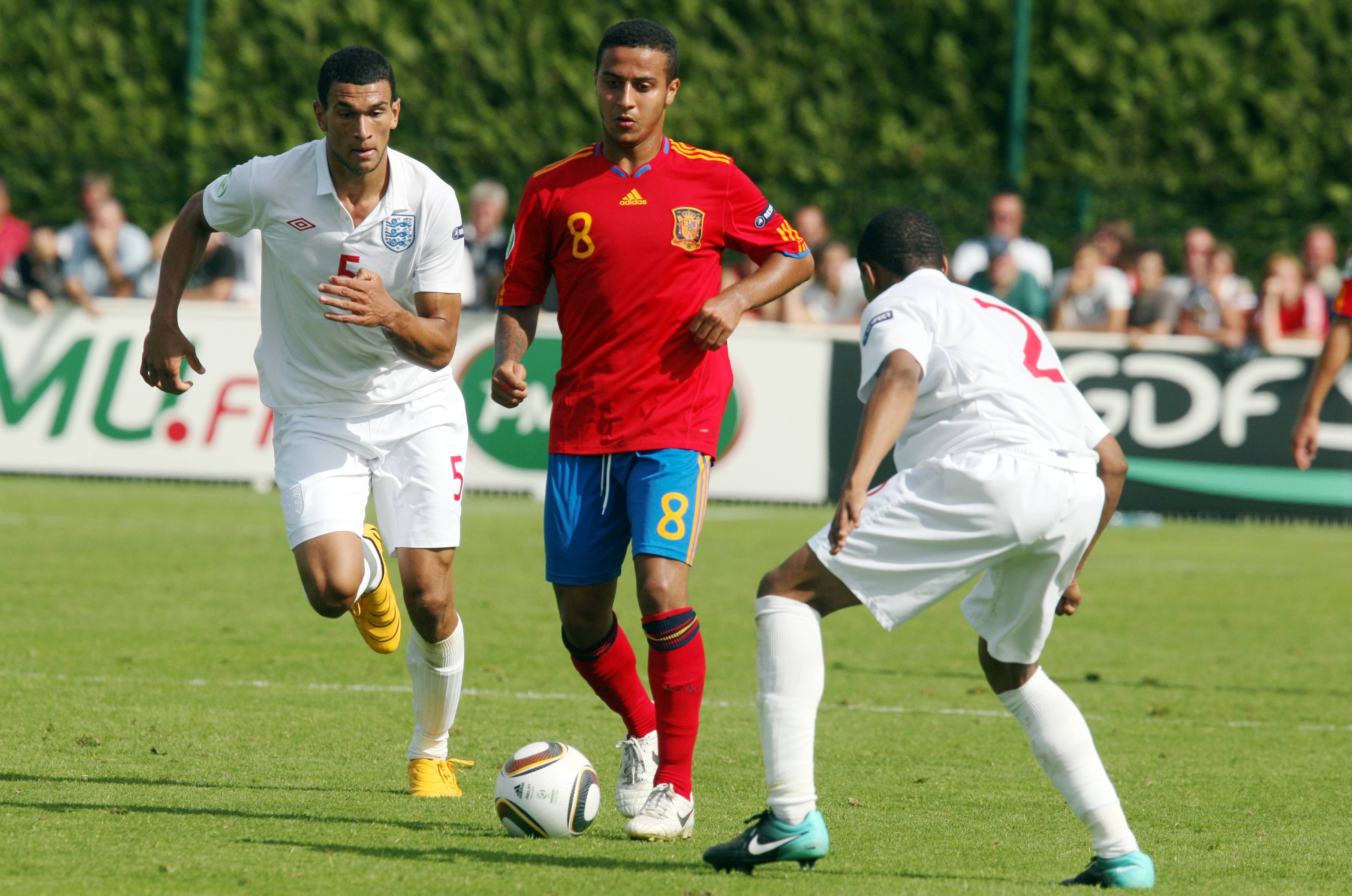 SAINT-LO, FRANCE -  JULY 27 : Steven Caulker (L) of England and Thiago Alcantara of Spain in action during the England v Spain UEFA U19 European Championship Semi Final at The Louis Villemer Stadium on July 27, 2010 in Saint-Lo, France. (Photo by Xavier L