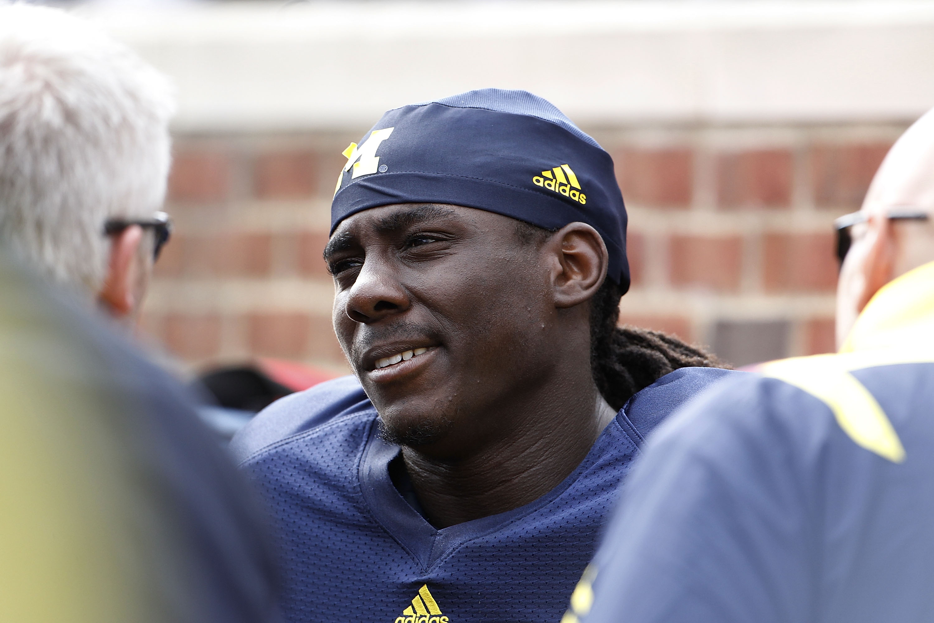 ANN ARBOR, MI - SEPTEMBER 25:  Denard Robinson #16 of the Michigan Wolverines talks with the Michigan Medical Staff during the first quarter of the game against Bowling Green on September 25, 2010 at Michigan Stadium in Ann Arbor, Michigan.  (Photo by Leo