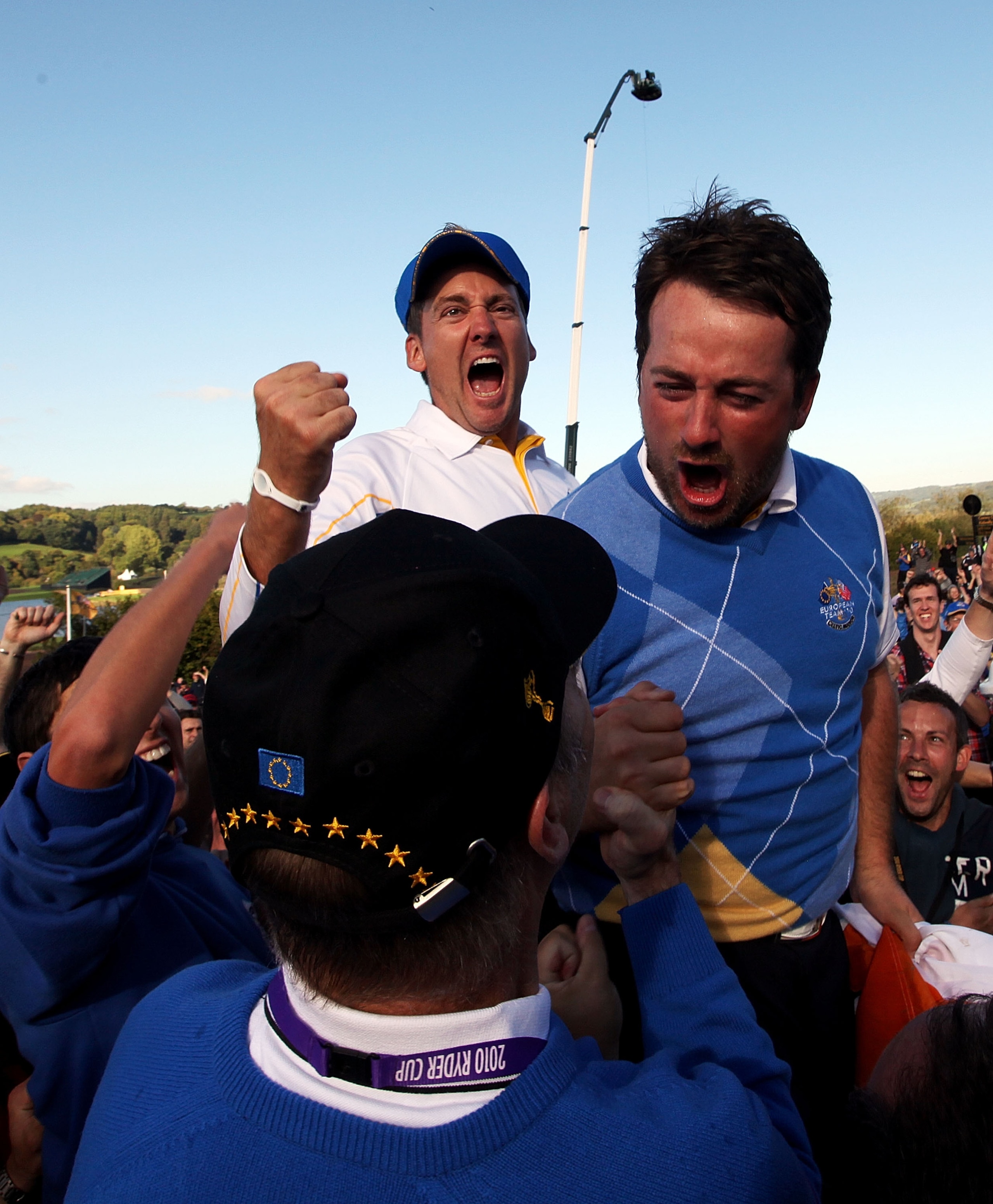 NEWPORT, WALES - OCTOBER 04:  Graeme McDowell (R) and Ian Poulter of Europe celebrates the victory for the European team at the end of the singles matches during the 2010 Ryder Cup at the Celtic Manor Resort on October 4, 2010 in Newport, Wales.  (Photo b