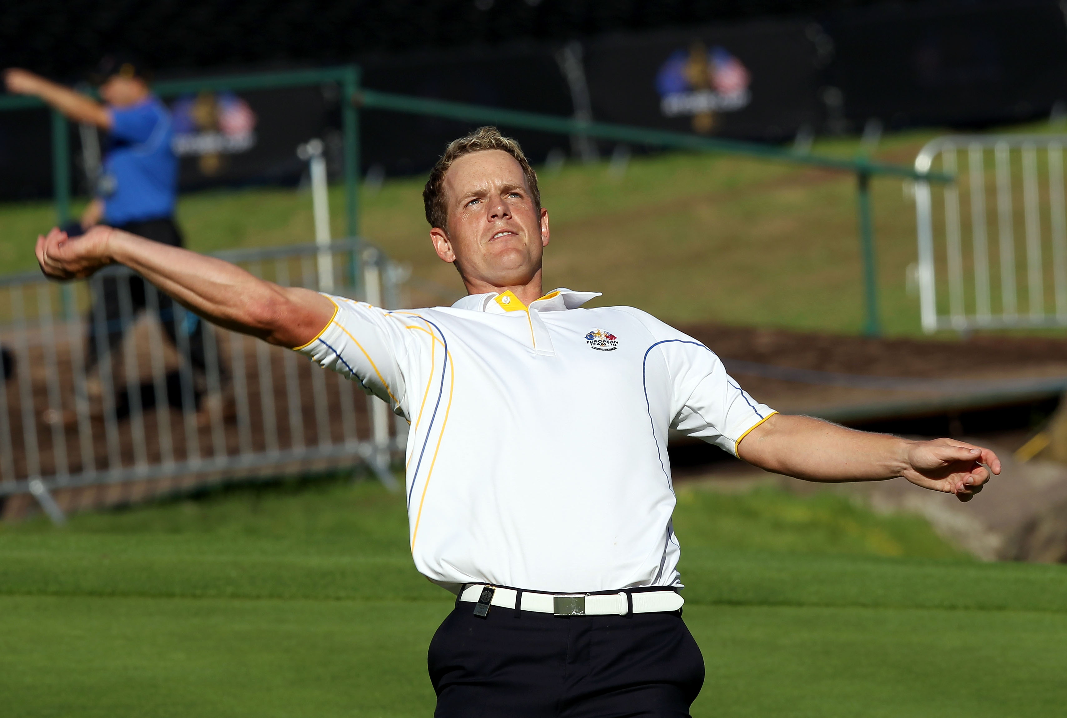 NEWPORT, WALES - OCTOBER 04:  Luke Donald of Europe throws his ball to the crowd after he won his match on the 18th green in the singles matches during the 2010 Ryder Cup at the Celtic Manor Resort on October 4, 2010 in Newport, Wales.  (Photo by Ross Kin