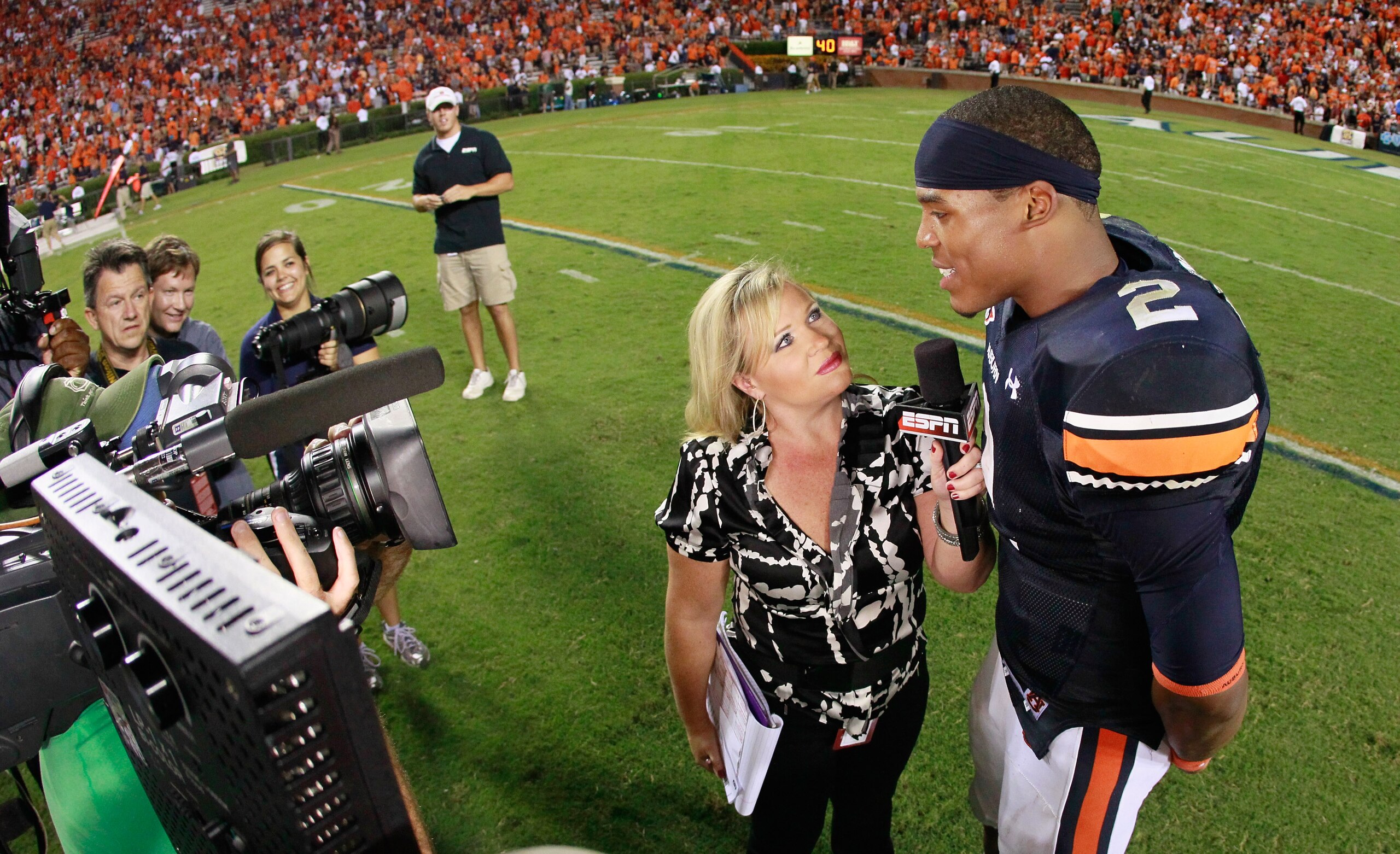 AUBURN, AL - SEPTEMBER 25:  ESPN reporter Holly Rowe interviews quarterback Cameron Newton #2 of the Auburn Tigers after their 35-27 win over the South Carolina Gamecocks at Jordan-Hare Stadium on September 25, 2010 in Auburn, Alabama.  (Photo by Kevin C.