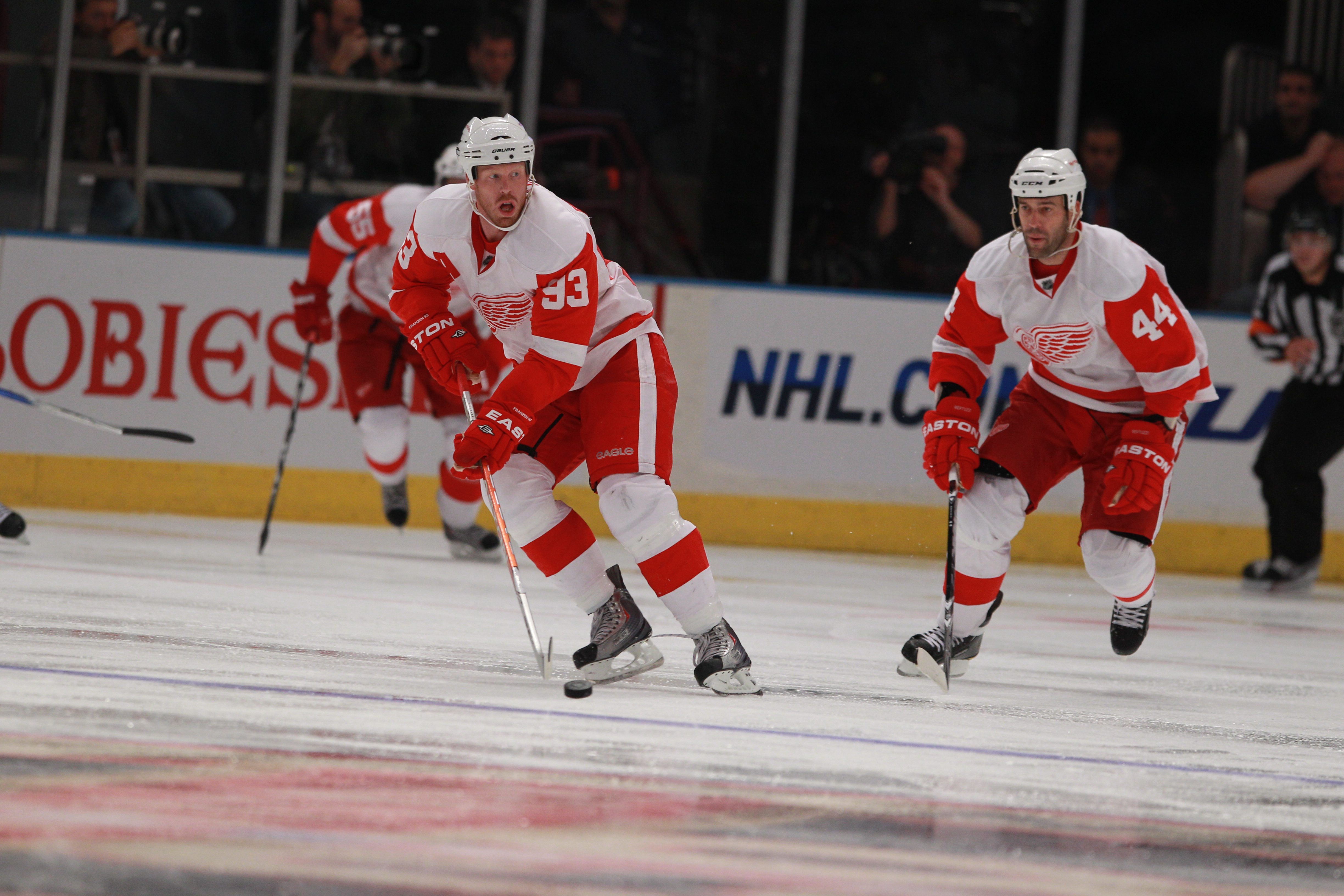 NEW YORK - SEPTEMBER 29:  Johan Franzen #93 and Todd Bertuzzi #44 of the Detroit Red Wings skate against the New York Rangers at Madison Square Garden on September 29, 2010 in New York City. The Rangers defeated the Red Wings 5-1. (Photo by Bruce Bennett