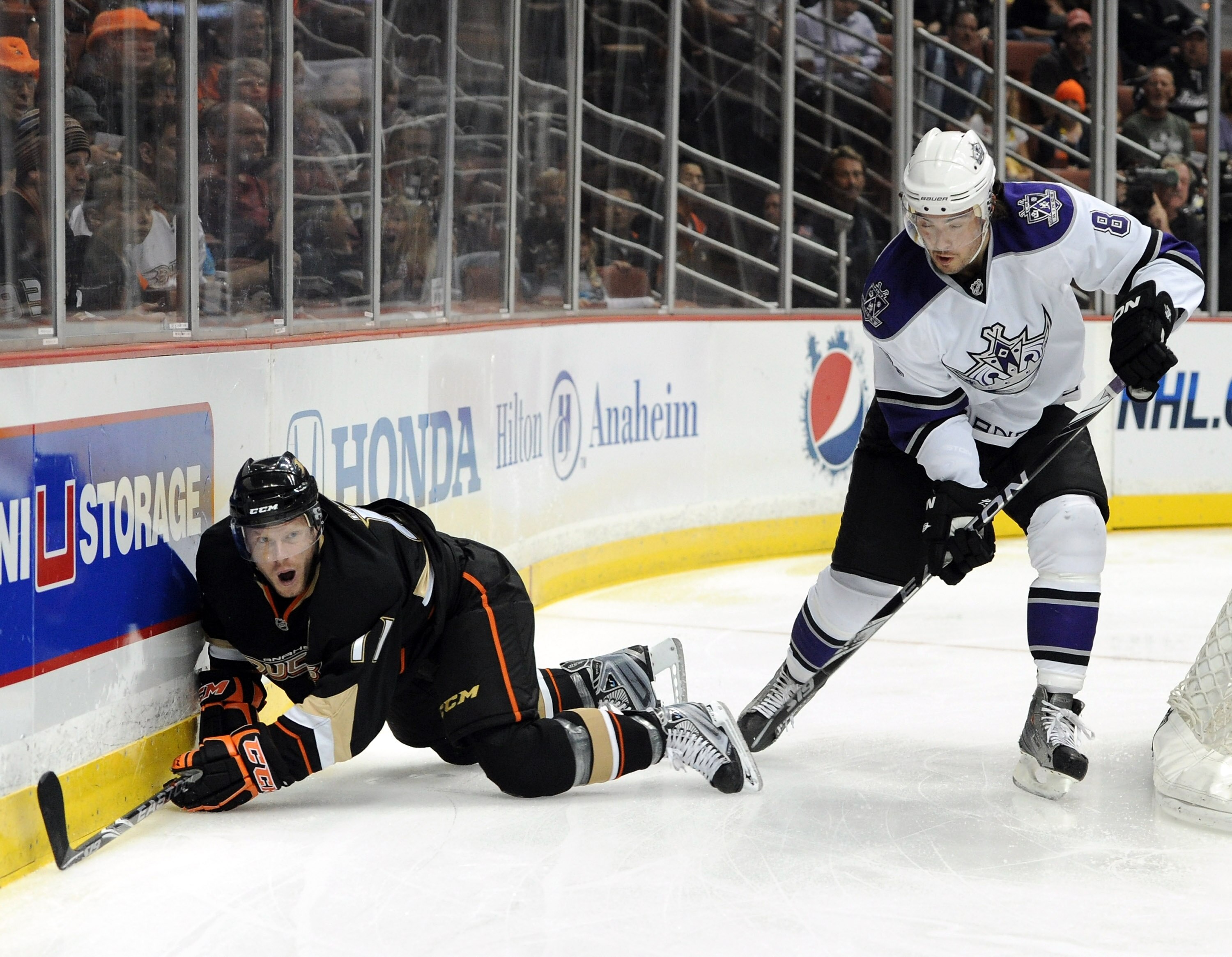 ANAHEIM, CA - OCTOBER 03:  Drew Doughty #8 of the Los Angeles Kings takes a penalty as he knocks Jason Blake #33 of the Anaheim Ducks to the ice during the first period at Honda Center on October 3, 2010 in Anaheim, California.  (Photo by Harry How/Getty
