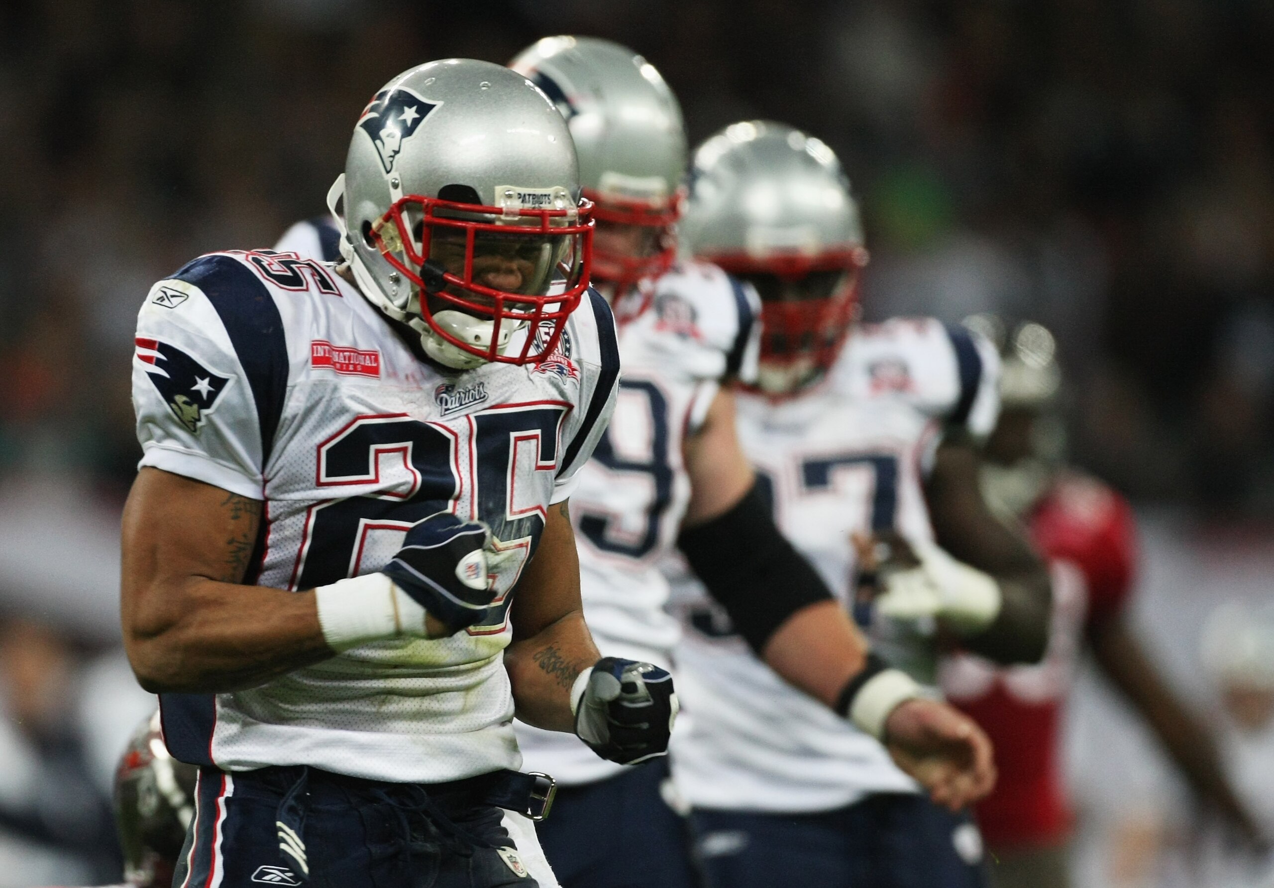 LONDON, ENGLAND - OCTOBER 25:  Pat Chung (#25) of the New England Patriots celebrates an intercept during the NFL International Series match between New England Patriots and Tampa Bay Buccaneers at Wembley Stadium on October 25, 2009 in London, England. T