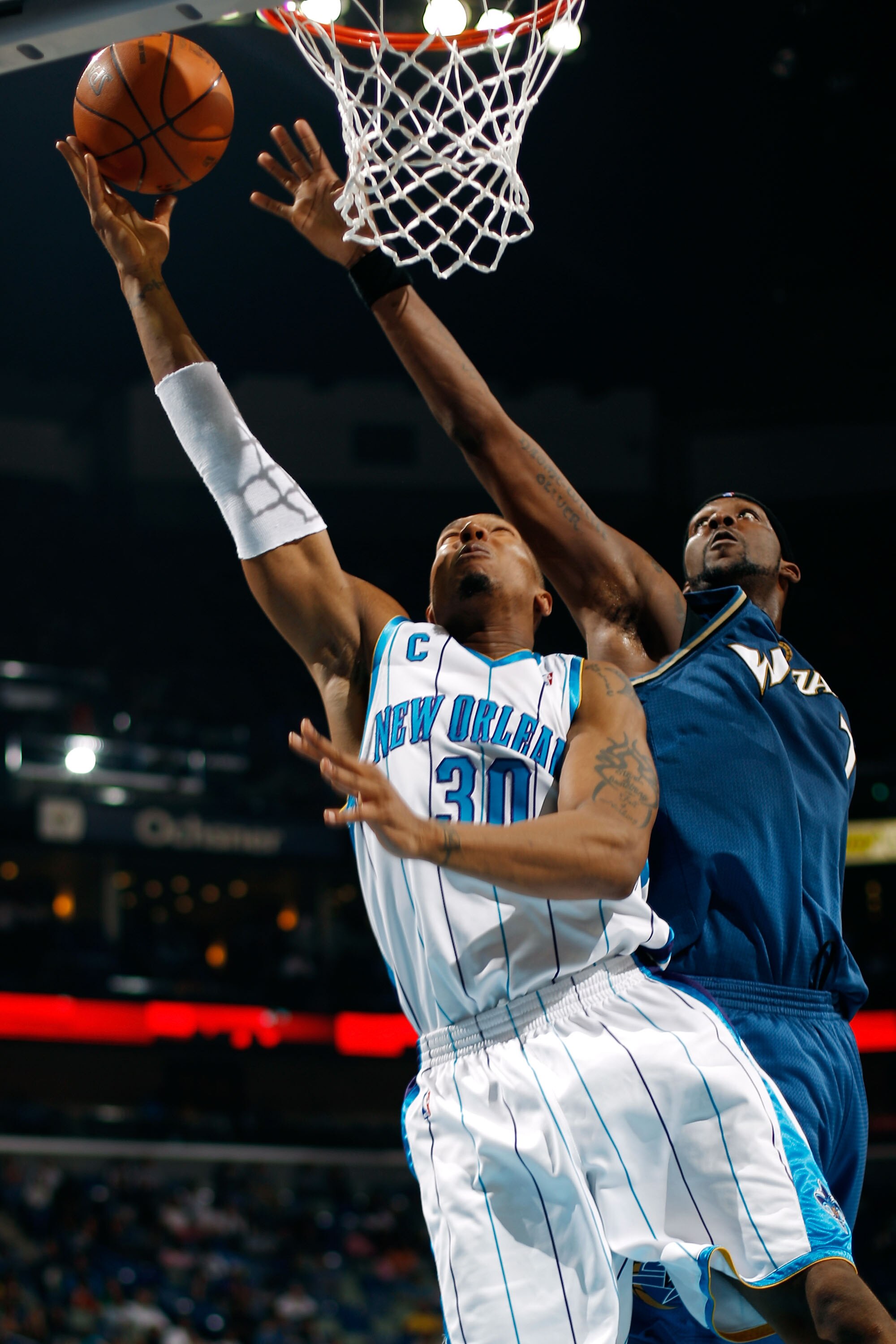 NEW ORLEANS - MARCH 31:  David West #30 of the New Orleans Hornets shoots the ball over Andray Blatche #7 of the Washington Wizards at New Orleans Arena on March 31, 2010 in New Orleans, Louisiana.  The Wizards defeated the Hornets 96-91.  NOTE TO USER: U