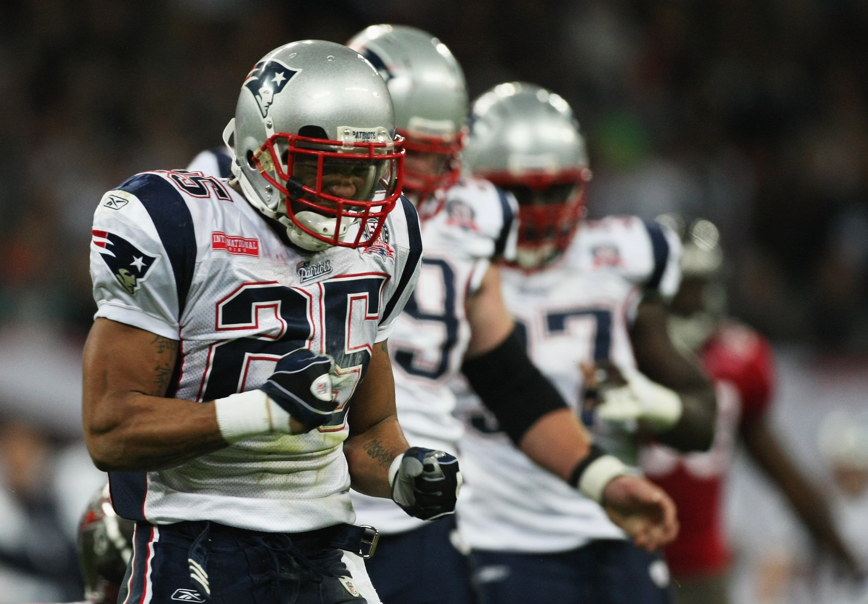 LONDON, ENGLAND - OCTOBER 25:  Pat Chung (#25) of the New England Patriots celebrates an intercept during the NFL International Series match between New England Patriots and Tampa Bay Buccaneers at Wembley Stadium on October 25, 2009 in London, England. T