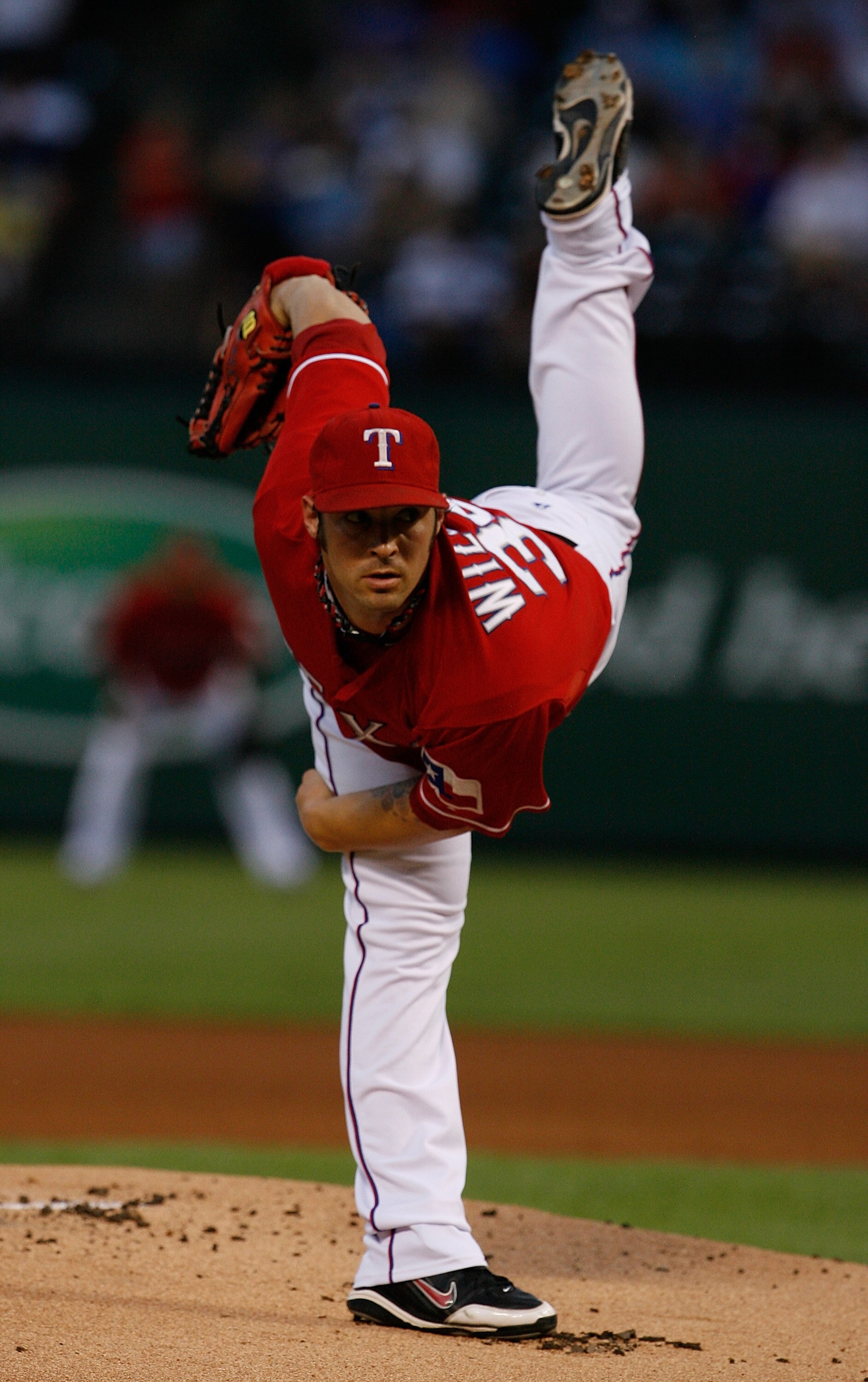 ARLINGTON, TX - SEPTEMBER 10:  Starting pitcher C.J. Wilson #36 of the Texas Rangers pitches against the New York Yankees on September 10, 2010 at Rangers Ballpark in Arlington, Texas.  (Photo by Tom Pennington/Getty Images)