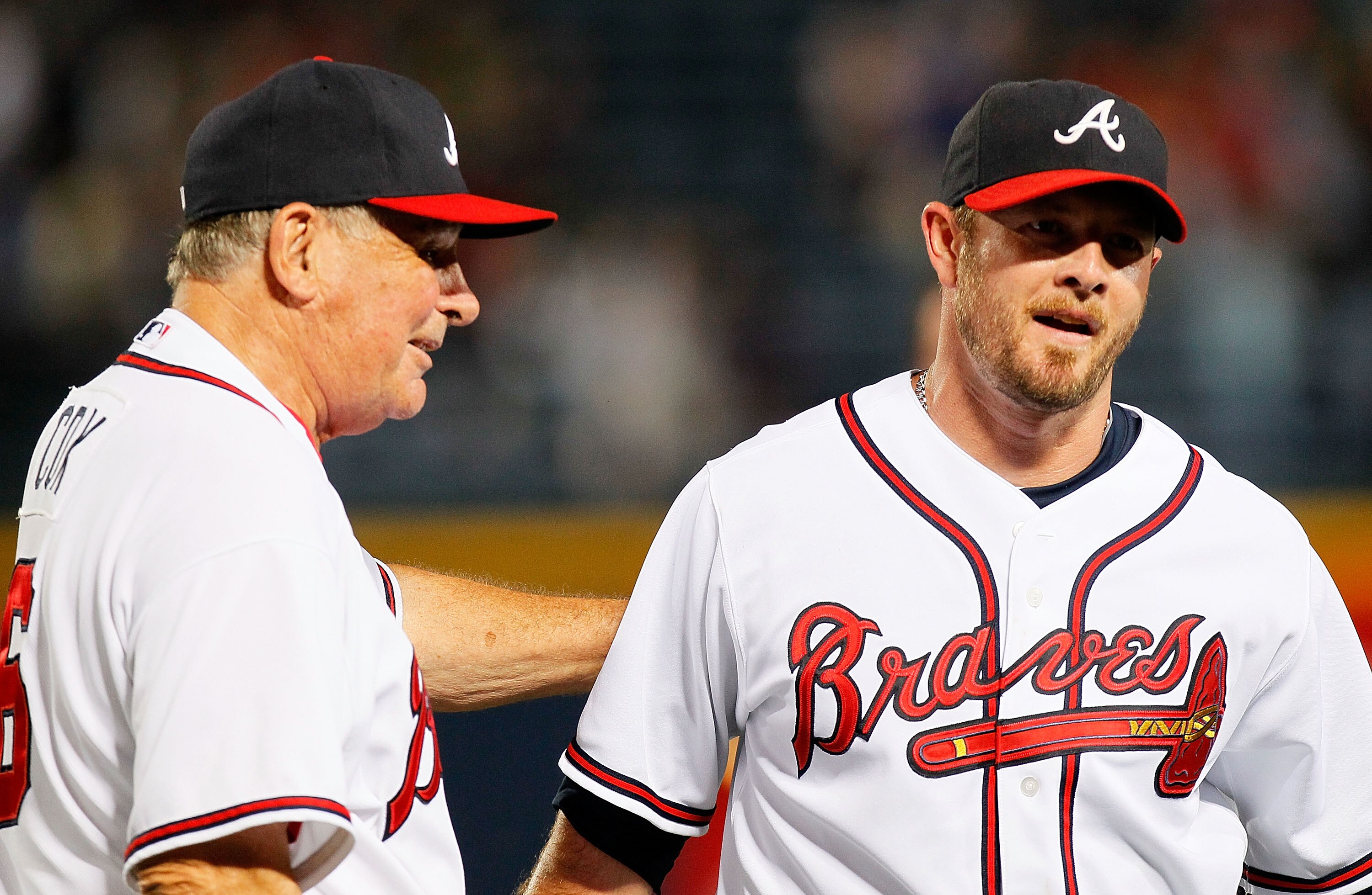 ATLANTA - JUNE 25:  Manager Bobby Cox #6 congratulates closer Billy Wagner #13 of the Atlanta Braves after his 400th career save with a 3-1 win against the Detroit Tigers at Turner Field on June 25, 2010 in Atlanta, Georgia.  (Photo by Kevin C. Cox/Getty